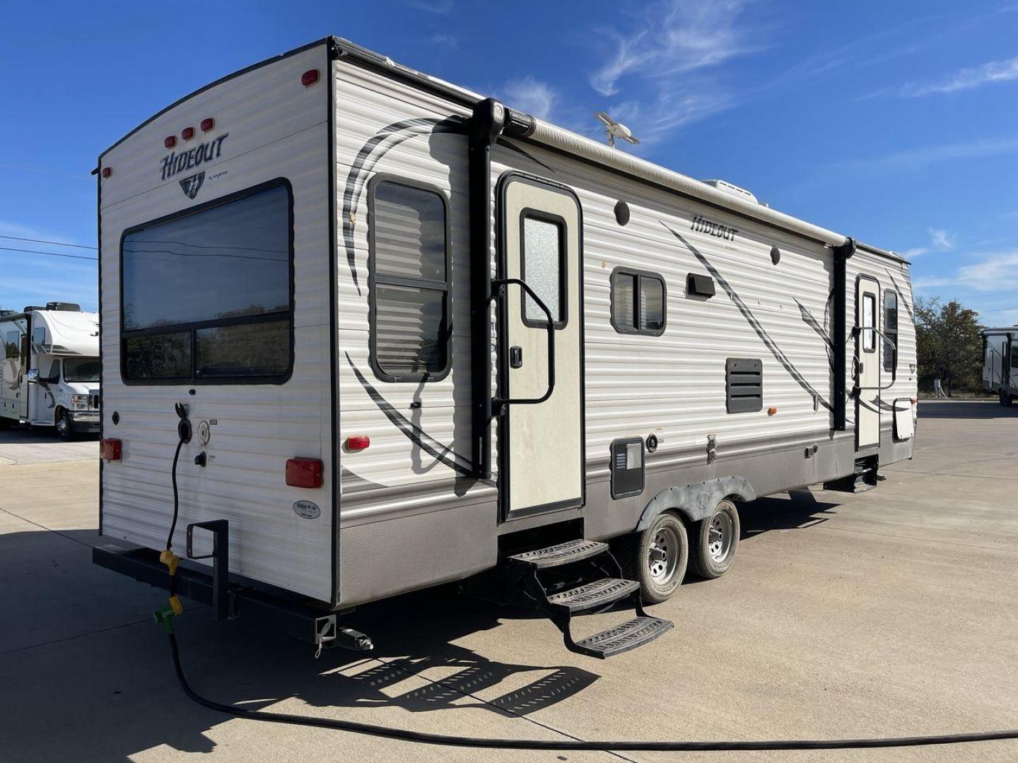 2016 KEYSTONE HIDEOUT (4YDT26R2XG7) , Length: 29.92 ft | Dry Weight: 6,334 lbs | Gross Weight: 7,835 lbs | Slides: 1 transmission, located at 4319 N Main Street, Cleburne, TX, 76033, (817) 221-0660, 32.435829, -97.384178 - The Hideout 26RLS by 26RLS travel trailer is a small, half-ton towable, inexpensive camper. It is 29.92 ft in length, 8 ft in width, and 11 ft in height. The dry weight is 6,334 lbs with a payload capacity of 1,501 lbs. The trailer has a GVWR of 7,835 lbs and a hitch weight of 835 lbs. It features l - Photo#25