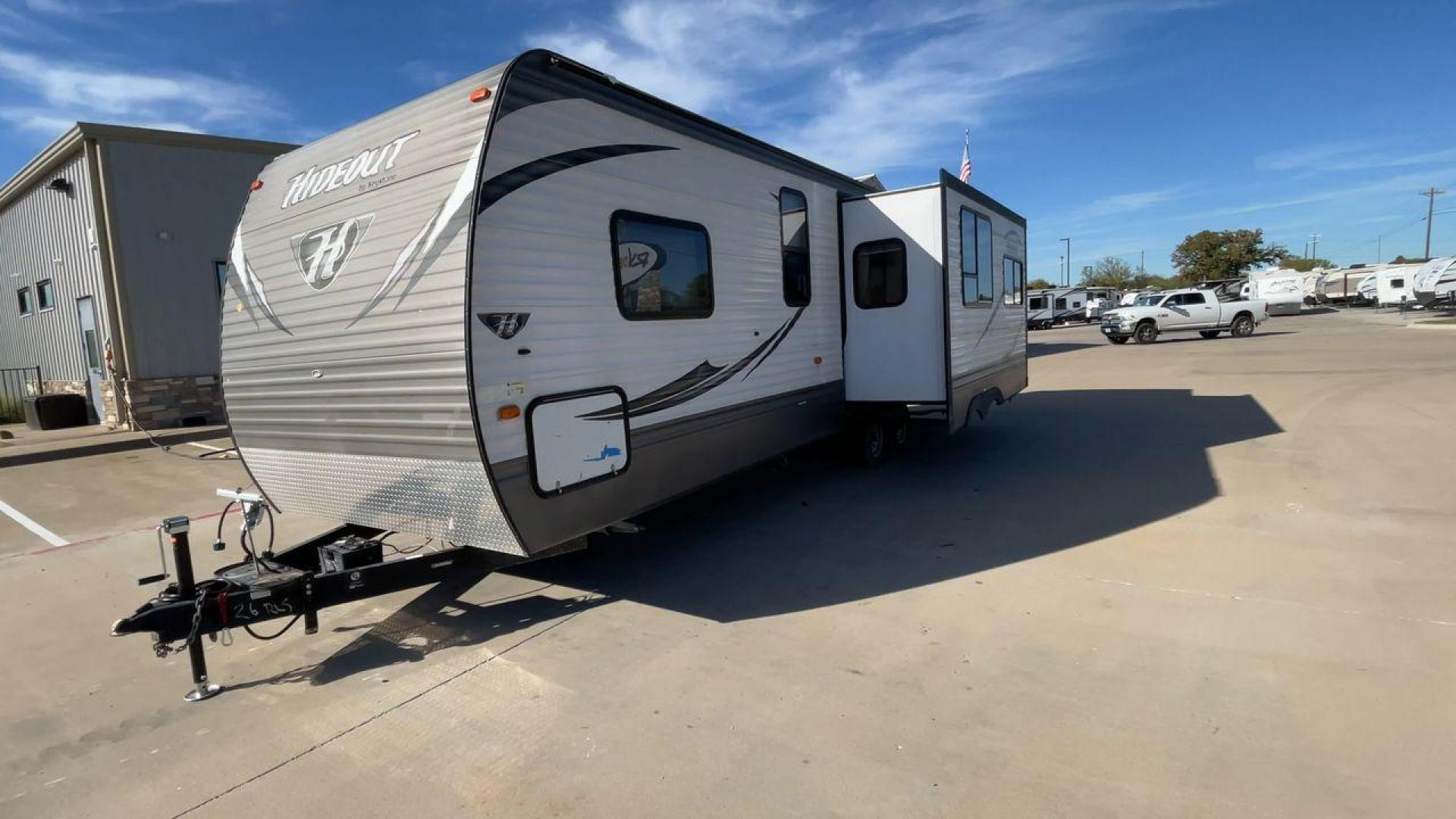 2016 KEYSTONE HIDEOUT (4YDT26R2XG7) , Length: 29.92 ft | Dry Weight: 6,334 lbs | Gross Weight: 7,835 lbs | Slides: 1 transmission, located at 4319 N Main Street, Cleburne, TX, 76033, (817) 221-0660, 32.435829, -97.384178 - The Hideout 26RLS by 26RLS travel trailer is a small, half-ton towable, inexpensive camper. It is 29.92 ft in length, 8 ft in width, and 11 ft in height. The dry weight is 6,334 lbs with a payload capacity of 1,501 lbs. The trailer has a GVWR of 7,835 lbs and a hitch weight of 835 lbs. It features l - Photo#5