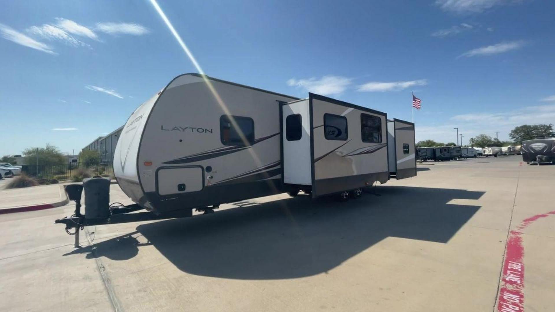 2016 TAN LAYTON 305BH - (5ZWTYTS21G4) , Length: 36.5 ft. | Dry Weight: 6,885 lbs. | Gross Weight: 11,200 lbs. | Slides: 2 transmission, located at 4319 N Main Street, Cleburne, TX, 76033, (817) 221-0660, 32.435829, -97.384178 - Go on your next trip with the 2016 Layton 305BH, a travel trailer that is roomy and well-equipped for comfort and ease of use. This RV provides ample space for the entire family to enjoy, measuring 36.5 feet in length and weighing 6,885 pounds when dry and 11,200 pounds when fully loaded. With two s - Photo#5