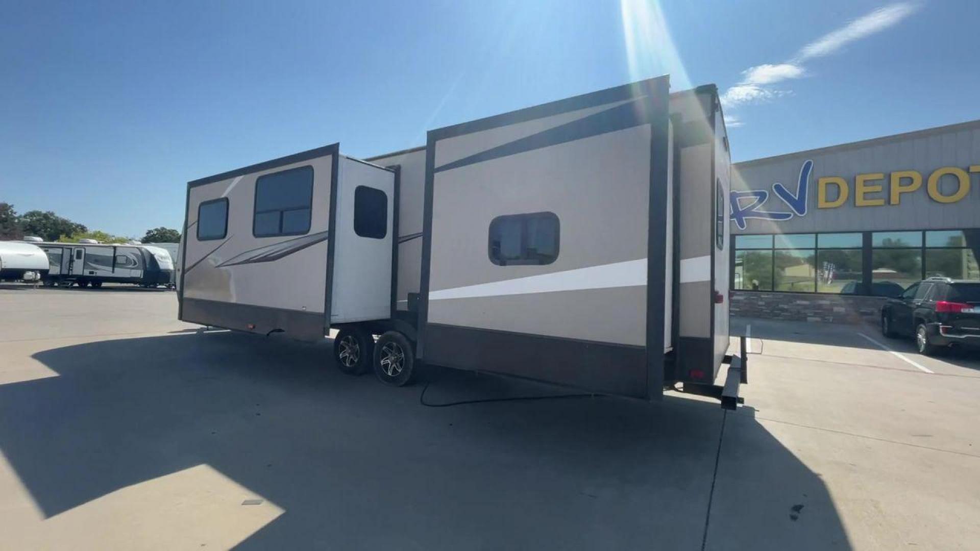 2016 TAN LAYTON 305BH - (5ZWTYTS21G4) , Length: 36.5 ft. | Dry Weight: 6,885 lbs. | Gross Weight: 11,200 lbs. | Slides: 2 transmission, located at 4319 N Main Street, Cleburne, TX, 76033, (817) 221-0660, 32.435829, -97.384178 - Go on your next trip with the 2016 Layton 305BH, a travel trailer that is roomy and well-equipped for comfort and ease of use. This RV provides ample space for the entire family to enjoy, measuring 36.5 feet in length and weighing 6,885 pounds when dry and 11,200 pounds when fully loaded. With two s - Photo#7