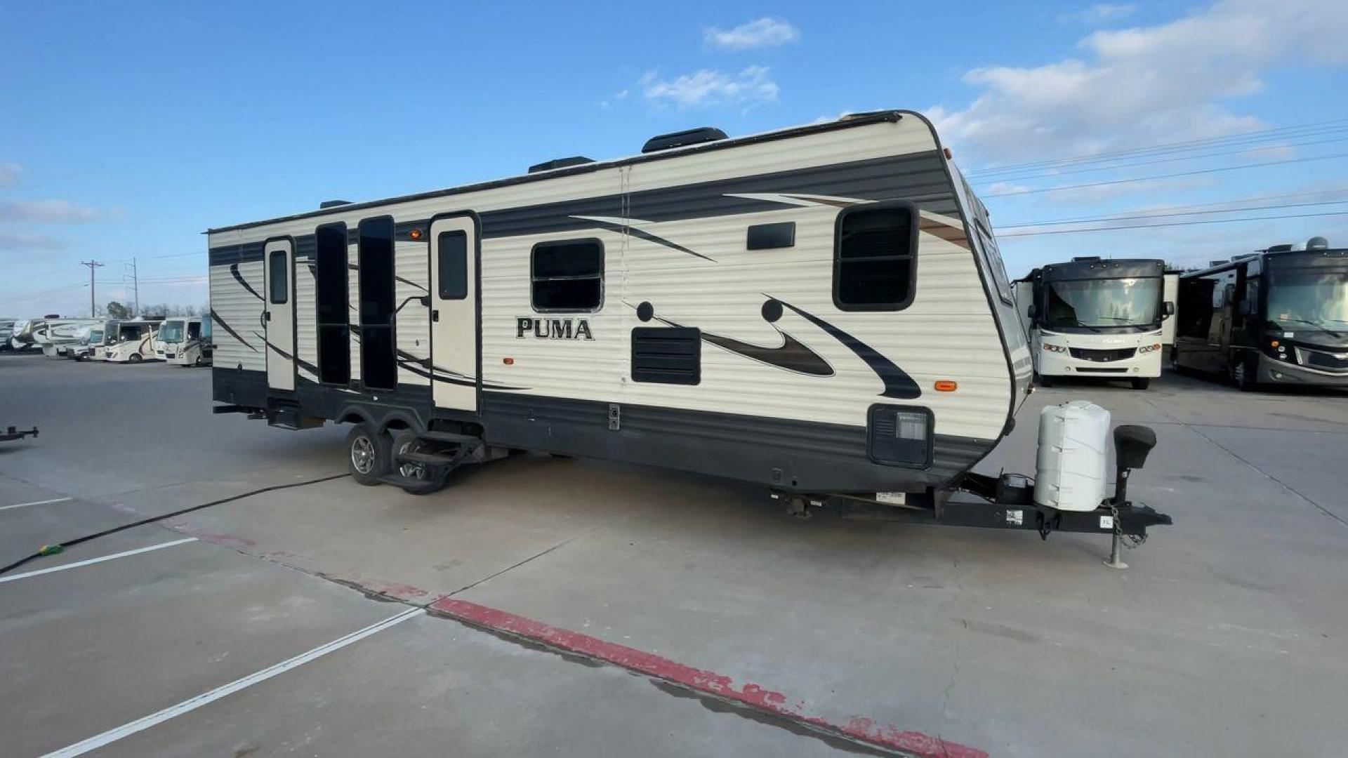 2016 TAN PALOMINO PUMA 30FKSS (4X4TPUF20GP) , Length: 34.75 ft. | Dry Weight: 7,992 lbs. | Gross Weight: 9,950 lbs. | Slides: 2 transmission, located at 4319 N Main Street, Cleburne, TX, 76033, (817) 221-0660, 32.435829, -97.384178 - Take advantage of the 2016 Palomino Puma 30FKSS Travel Trailer and embrace the spirit of adventure. With its stylish, functional, and comfortable design, this travel trailer provides a cozy living area for your road trips. This unit has dimensions of 34.75 ft in length, 8 ft in width, and 11.08 ft i - Photo#3