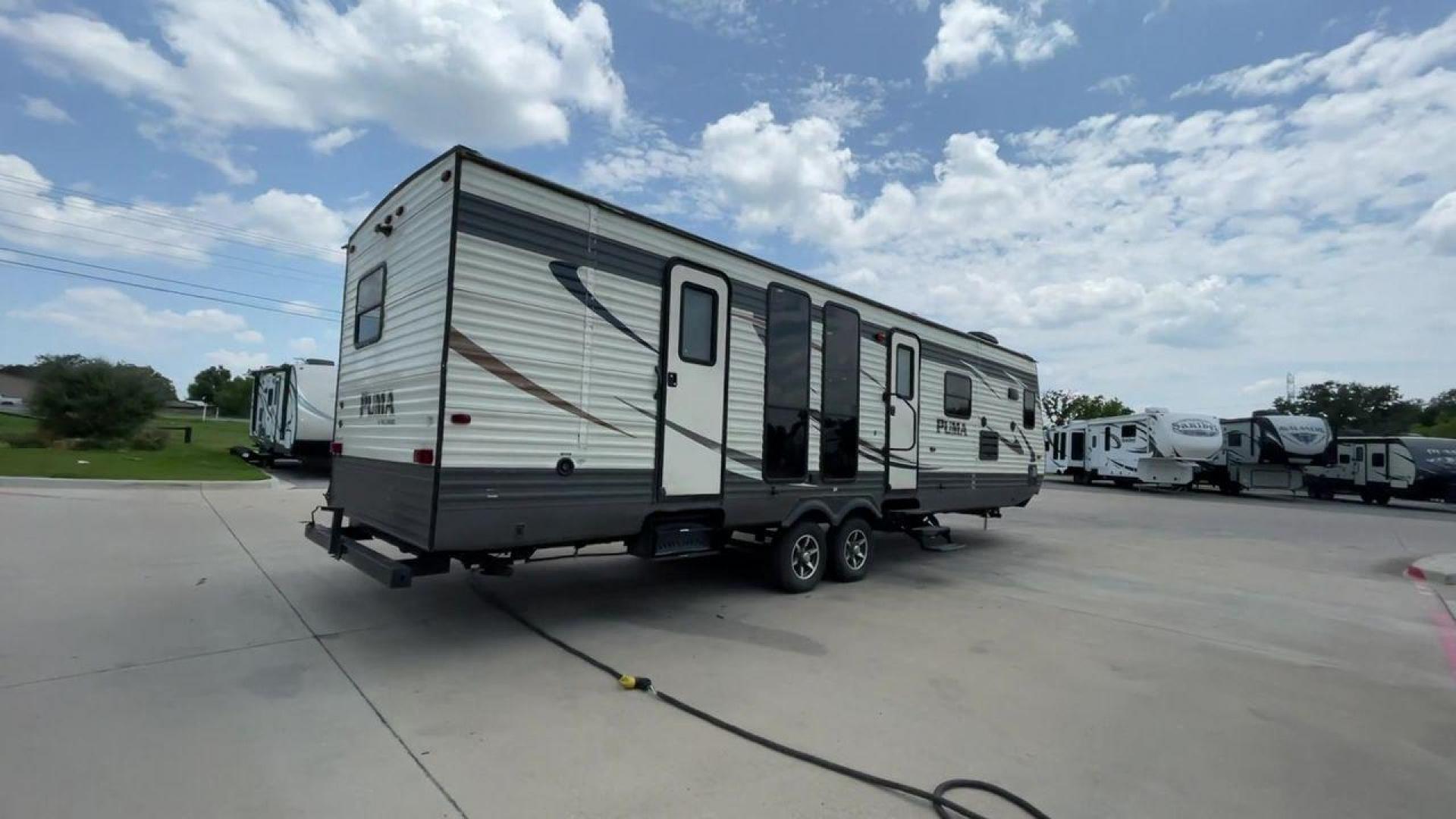 2016 TAN PALOMINO PUMA 30FKSS (4X4TPUF20GP) , Length: 34.75 ft. | Dry Weight: 7,992 lbs. | Gross Weight: 9,950 lbs. | Slides: 2 transmission, located at 4319 N Main Street, Cleburne, TX, 76033, (817) 221-0660, 32.435829, -97.384178 - Take advantage of the 2016 Palomino Puma 30FKSS Travel Trailer and embrace the spirit of adventure. With its stylish, functional, and comfortable design, this travel trailer provides a cozy living area for your road trips. This unit has dimensions of 34.75 ft in length, 8 ft in width, and 11.08 f - Photo#1