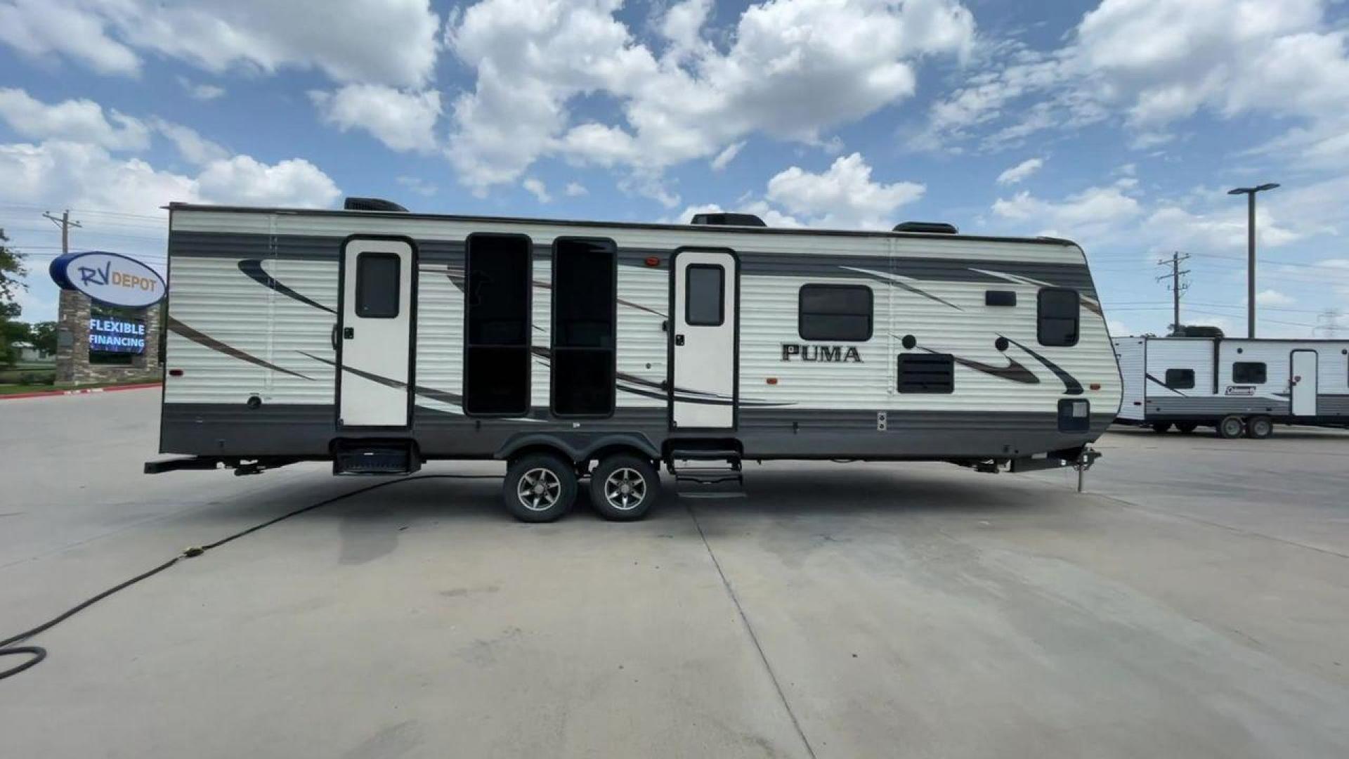 2016 TAN PALOMINO PUMA 30FKSS (4X4TPUF20GP) , Length: 34.75 ft. | Dry Weight: 7,992 lbs. | Gross Weight: 9,950 lbs. | Slides: 2 transmission, located at 4319 N Main Street, Cleburne, TX, 76033, (817) 221-0660, 32.435829, -97.384178 - Take advantage of the 2016 Palomino Puma 30FKSS Travel Trailer and embrace the spirit of adventure. With its stylish, functional, and comfortable design, this travel trailer provides a cozy living area for your road trips. This unit has dimensions of 34.75 ft in length, 8 ft in width, and 11.08 f - Photo#2