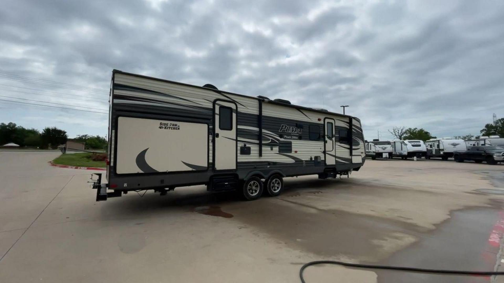 2016 PALOMINO PUMA 31BHSS (4X4TPUG27GP) , Length: 35.33 ft. | Dry Weight: 7,958 lbs. | Gross Weight: 9,600 lbs. | Slides: 2 transmission, located at 4319 N Main Street, Cleburne, TX, 76033, (817) 221-0660, 32.435829, -97.384178 - Photo#1