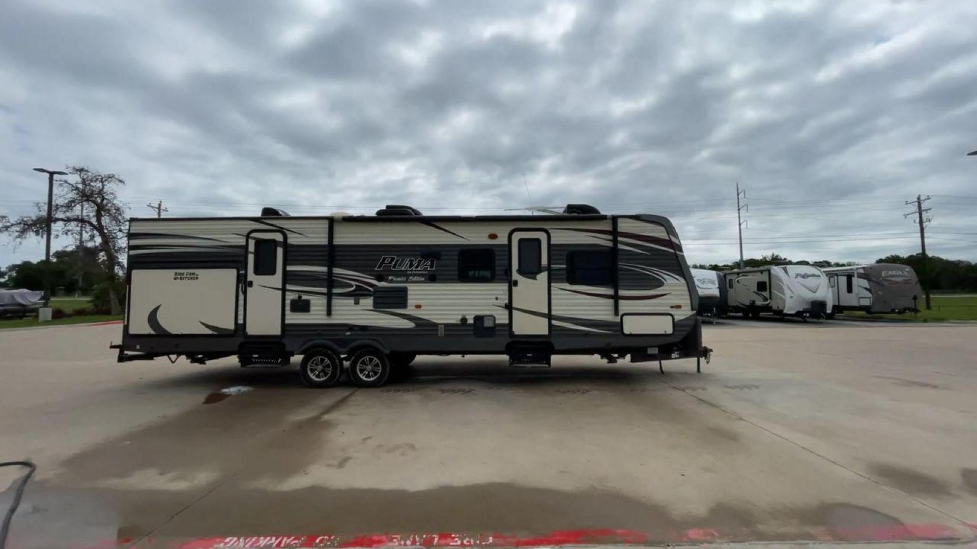 2016 PALOMINO PUMA 31BHSS (4X4TPUG27GP) , Length: 35.33 ft. | Dry Weight: 7,958 lbs. | Gross Weight: 9,600 lbs. | Slides: 2 transmission, located at 4319 N Main Street, Cleburne, TX, 76033, (817) 221-0660, 32.435829, -97.384178 - Photo#2