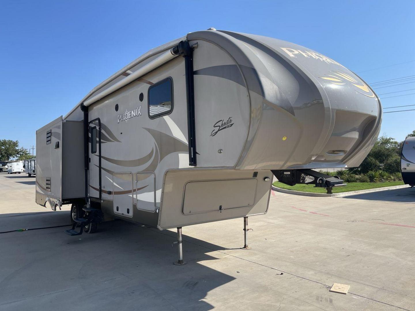 2016 TAN PHOENIX 32RE (5ZT3SPXB3GF) , Length: 33.92 ft. | Dry Weight: 9,120 lbs. | Gross Weight: 11,834 lbs. | Slides: 3 transmission, located at 4319 N Main Street, Cleburne, TX, 76033, (817) 221-0660, 32.435829, -97.384178 - This 2016 Phoenix 32RE is a well-equipped fifth wheel that provides excellent value. It is designed with 3 spacious slides and offers sleeping space for up to 6 people. It measures 33.92 ft. in length and 8.33 ft. in width. It has a dry weight of 9,120 lbs. and a GVWR of 11,834 lbs. This fifth wheel - Photo#23