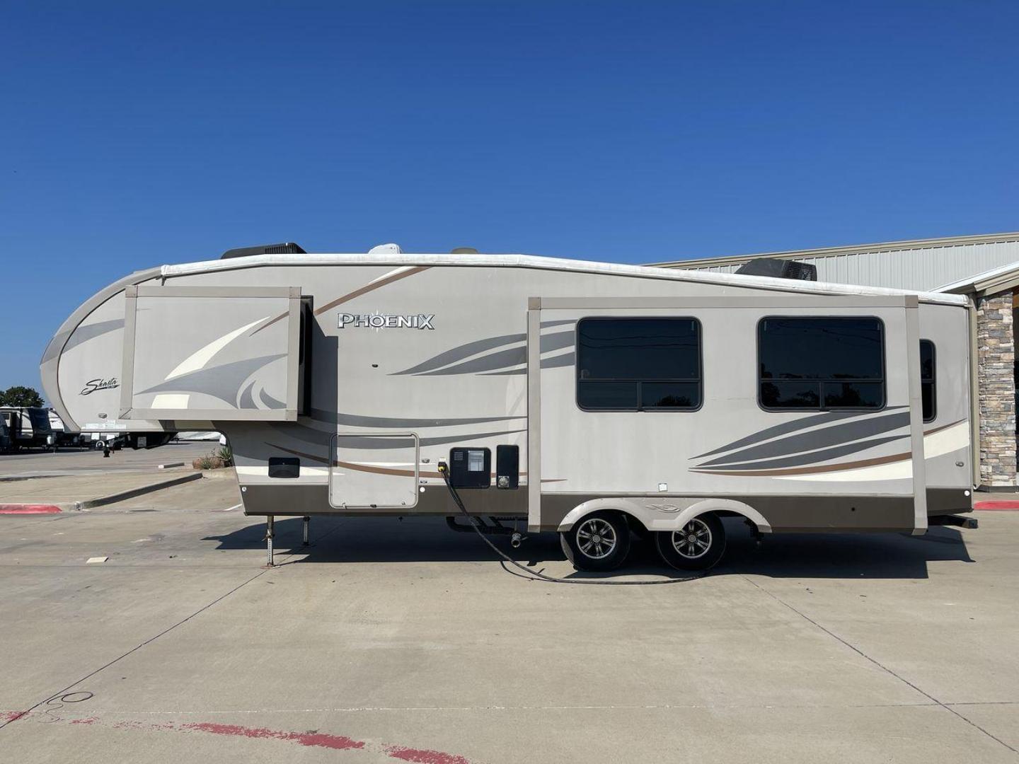 2016 TAN PHOENIX 32RE (5ZT3SPXB3GF) , Length: 33.92 ft. | Dry Weight: 9,120 lbs. | Gross Weight: 11,834 lbs. | Slides: 3 transmission, located at 4319 N Main Street, Cleburne, TX, 76033, (817) 221-0660, 32.435829, -97.384178 - This 2016 Phoenix 32RE is a well-equipped fifth wheel that provides excellent value. It is designed with 3 spacious slides and offers sleeping space for up to 6 people. It measures 33.92 ft. in length and 8.33 ft. in width. It has a dry weight of 9,120 lbs. and a GVWR of 11,834 lbs. This fifth wheel - Photo#24