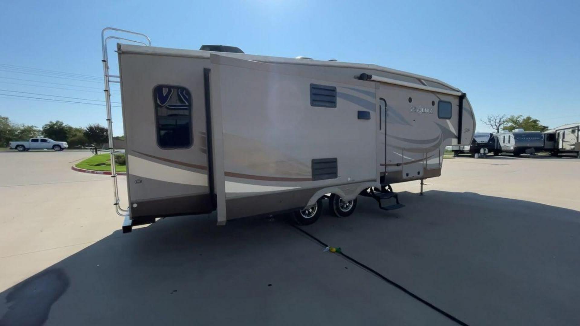 2016 TAN PHOENIX 32RE (5ZT3SPXB3GF) , Length: 33.92 ft. | Dry Weight: 9,120 lbs. | Gross Weight: 11,834 lbs. | Slides: 3 transmission, located at 4319 N Main Street, Cleburne, TX, 76033, (817) 221-0660, 32.435829, -97.384178 - This 2016 Phoenix 32RE is a well-equipped fifth wheel that provides excellent value. It is designed with 3 spacious slides and offers sleeping space for up to 6 people. It measures 33.92 ft. in length and 8.33 ft. in width. It has a dry weight of 9,120 lbs. and a GVWR of 11,834 lbs. This fifth wheel - Photo#1