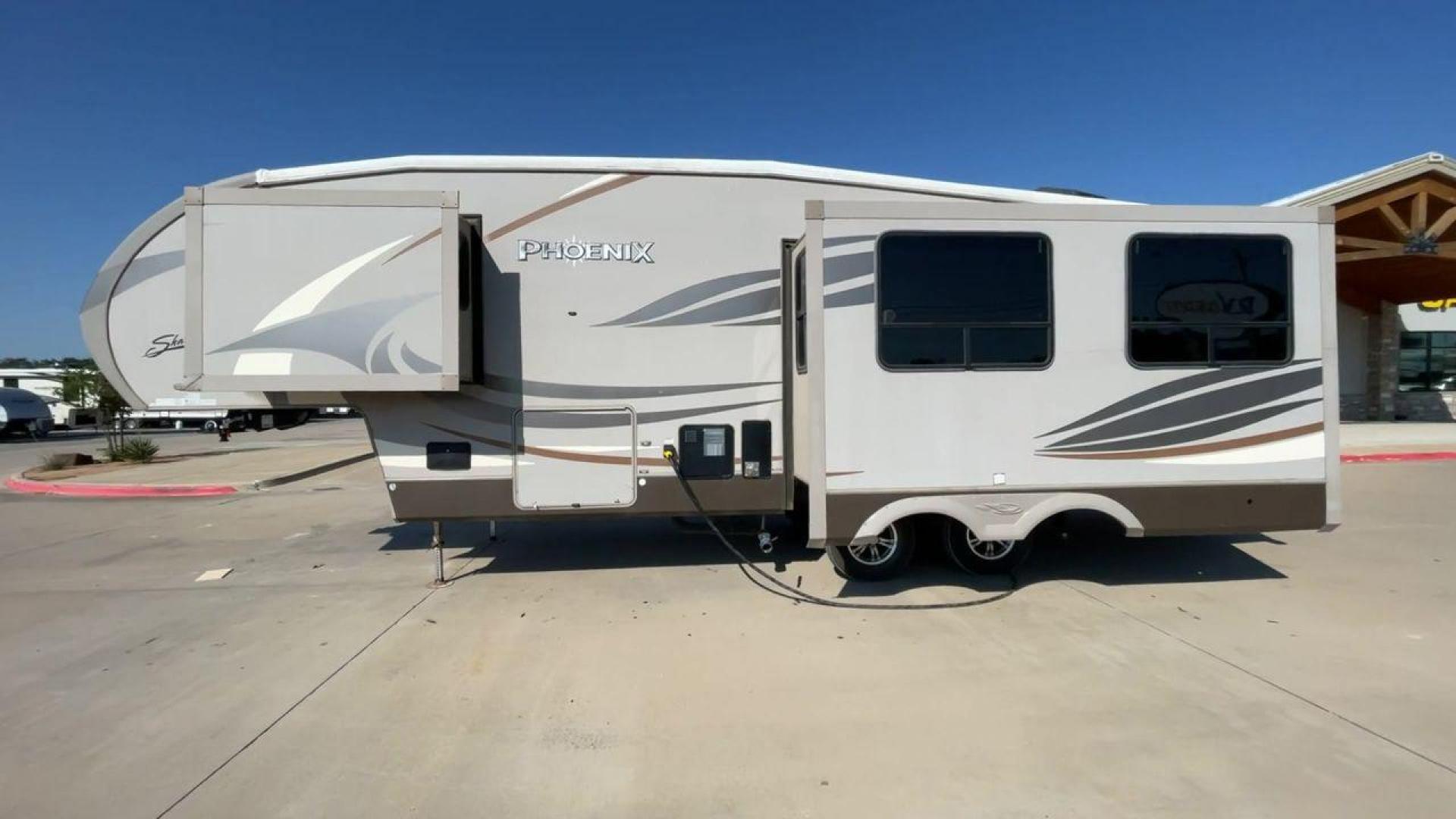 2016 TAN PHOENIX 32RE (5ZT3SPXB3GF) , Length: 33.92 ft. | Dry Weight: 9,120 lbs. | Gross Weight: 11,834 lbs. | Slides: 3 transmission, located at 4319 N Main Street, Cleburne, TX, 76033, (817) 221-0660, 32.435829, -97.384178 - This 2016 Phoenix 32RE is a well-equipped fifth wheel that provides excellent value. It is designed with 3 spacious slides and offers sleeping space for up to 6 people. It measures 33.92 ft. in length and 8.33 ft. in width. It has a dry weight of 9,120 lbs. and a GVWR of 11,834 lbs. This fifth wheel - Photo#6