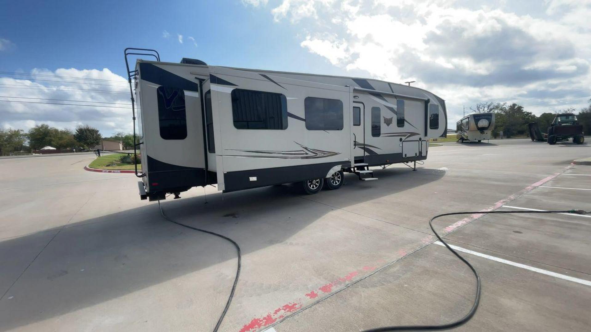 2016 TAN SABRE 365MB (4X4FSRN29G3) , Length: 42.42 ft. | Dry Weight: 12,994 lbs. | Gross Weight: 15,500 lbs. | Slides: 4 transmission, located at 4319 N Main Street, Cleburne, TX, 76033, (817) 221-0660, 32.435829, -97.384178 - The 2016 Sabre 365MB Fifth Wheel stretches 42.42 feet in length, with a commanding presence on the road and at the campground. The exterior is finished in a beige and black color scheme, accented with bold swooping graphics that add an athletic flair to its overall look. The side profile features fo - Photo#1