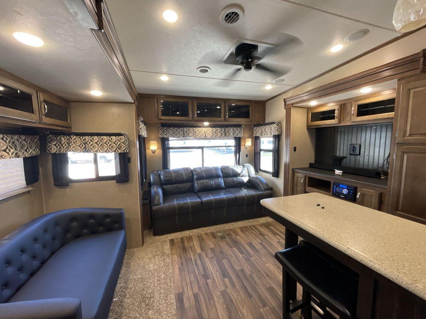 2017 COACHMEN CHAPARRAL 360IBL (5ZT3CH1B0HA) , Length: 39.67 ft. | Dry Weight: 11,449 lbs. | Gross Weight: 14,000 lbs. | Slides: 4 transmission, located at 4319 N Main Street, Cleburne, TX, 76033, (817) 221-0660, 32.435829, -97.384178 - With a length of 39.67 ft., the 2017 Coachmen Chaparral 360IBL is a luxurious and spacious fifth-wheel RV, ideal for families or groups looking for comfort and convenience while on the road. The exterior is sleek with a beige and black color scheme, accented by clean, modern graphics. The RV has a f - Photo#11