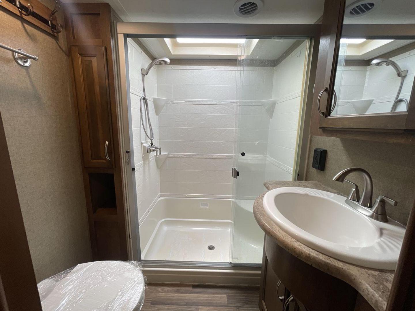 2017 COACHMEN CHAPARRAL 360IBL (5ZT3CH1B0HA) , Length: 39.67 ft. | Dry Weight: 11,449 lbs. | Gross Weight: 14,000 lbs. | Slides: 4 transmission, located at 4319 N Main Street, Cleburne, TX, 76033, (817) 221-0660, 32.435829, -97.384178 - With a length of 39.67 ft., the 2017 Coachmen Chaparral 360IBL is a luxurious and spacious fifth-wheel RV, ideal for families or groups looking for comfort and convenience while on the road. The exterior is sleek with a beige and black color scheme, accented by clean, modern graphics. The RV has a f - Photo#15