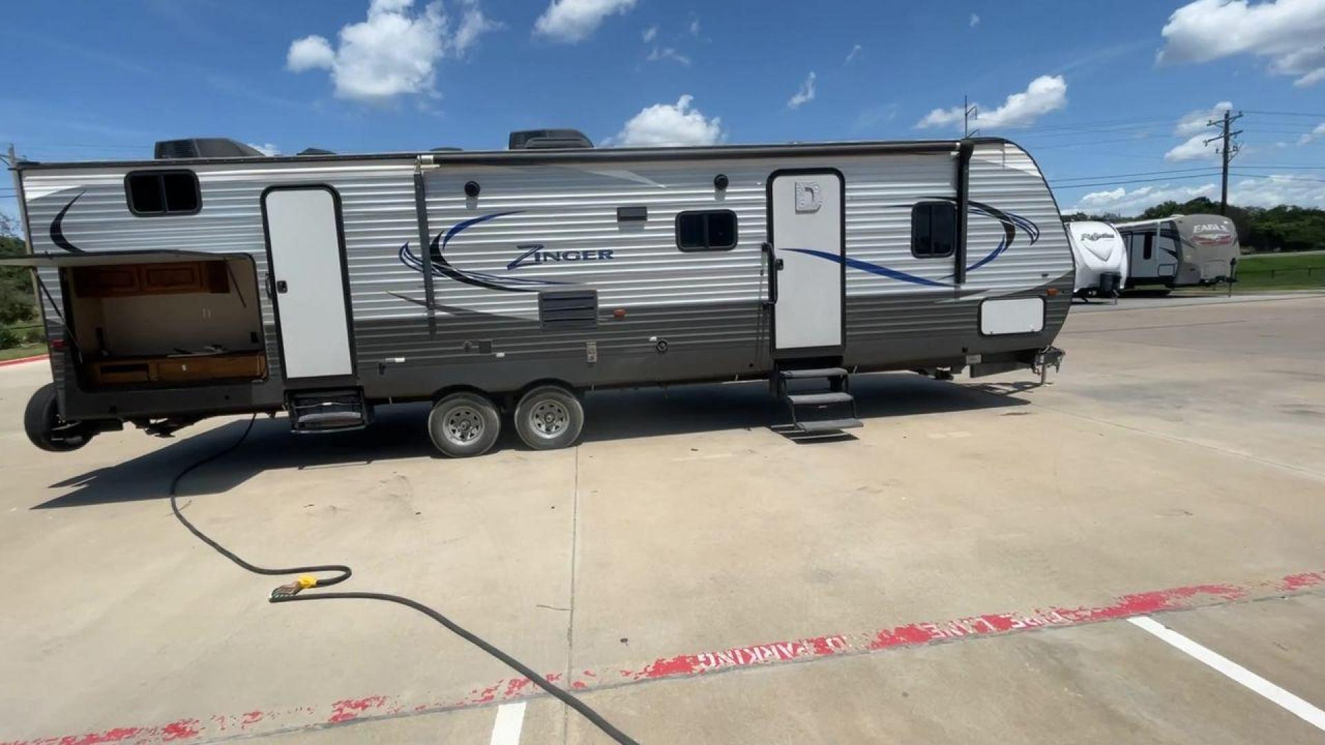 2017 CROSSROADS RV ZINGER 33SB (4V0TC3329HJ) , Length: 37.17 ft.| Dry Weight: 8,298 lbs. | Gross Weight: 9,900 lbs | Slides: 2 transmission, located at 4319 N Main Street, Cleburne, TX, 76033, (817) 221-0660, 32.435829, -97.384178 - The 2017 Crossroads RV Zinger 33SB offers the finest in family-friendly camping. This roomy travel trailer has a length of 37.17 feet and a dry weight of 8,298 pounds, providing plenty of room and comfort for your outdoor adventures. With a bunkhouse floor plan, the Zinger 33SB has two slides, provi - Photo#2