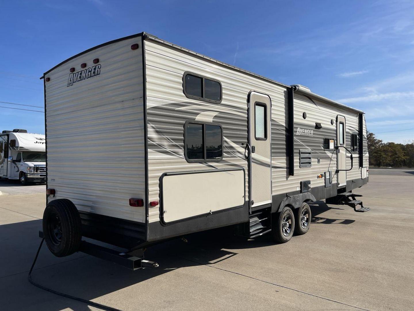 2017 FOREST RIVER AVENGER 30QBS (5ZT2AVVB3HB) , Length: 33.92 ft. | Dry Weight: 7,151 lbs. | Gross Weight: 9,685 lbs. | Slides: 1 transmission, located at 4319 N Main Street, Cleburne, TX, 76033, (817) 221-0660, 32.435829, -97.384178 - The 2017 Avenger 30QBS is a well-designed travel trailer that showcases a rugged yet stylish exterior. With a length of 33.92 feet, this RV presents a spacious and balanced silhouette. A sleek gray finish covers the side panels, complemented by black and silver graphic accents that enhance the moder - Photo#24