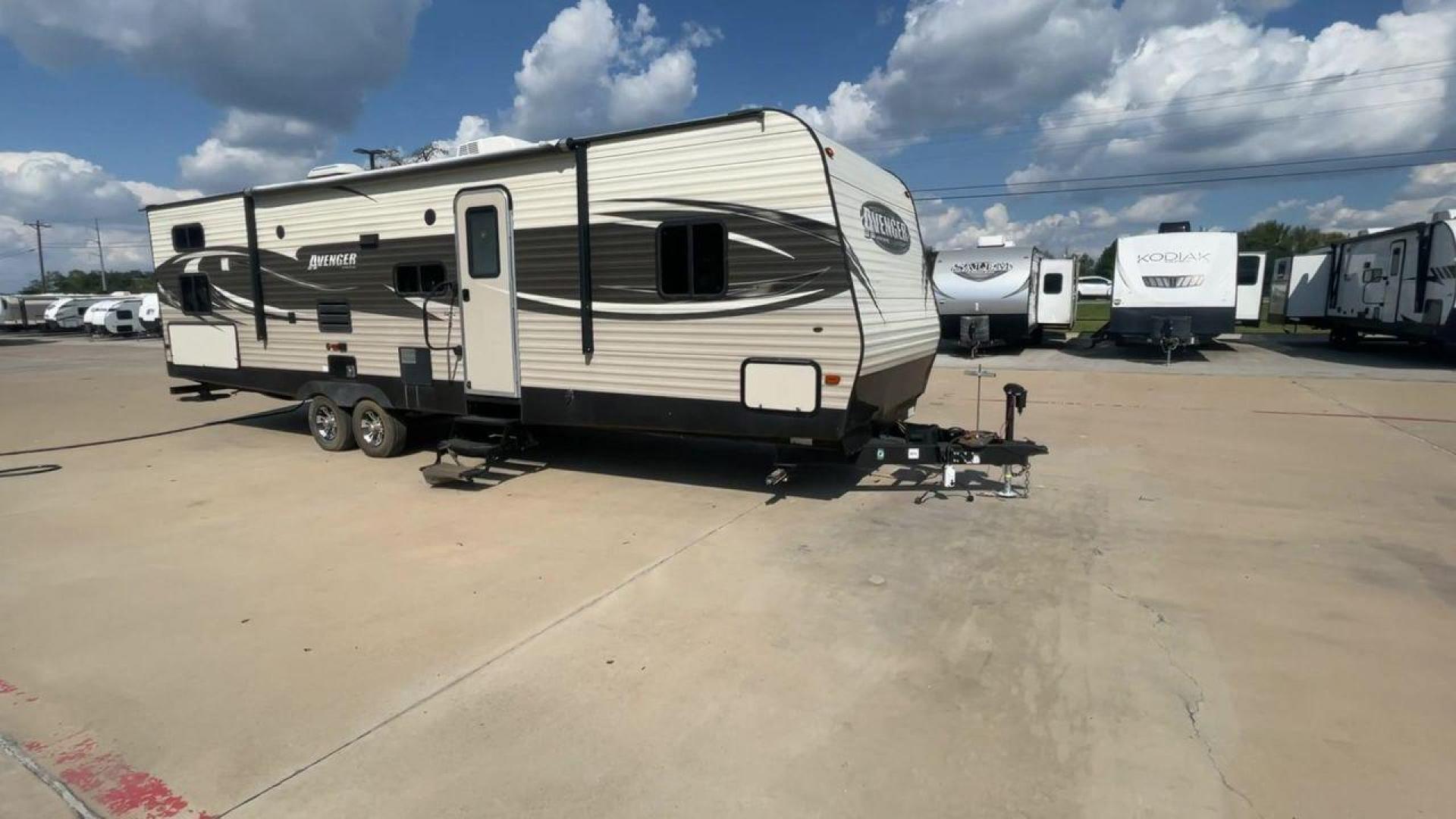 2017 TAN FOREST RIVER AVENGER 31DBS (5ZT2AVWB1HB) , Length: 35.75 ft | Dry Weight: 7,189 lbs. | Gross Weight: 9,589 lbs. | Slides: 1 transmission, located at 4319 N Main Street, Cleburne, TX, 76033, (817) 221-0660, 32.435829, -97.384178 - This is the 2017 Forest River Avenger 31DBS. It's your ticket to fun and excitement on the open road with your family. The length of this travel trailer is 35.75 feet and its dry weight is 7,189 lbs. When you walk inside, you'll find a plan that was made for comfort and ease. The bathroom in the bac - Photo#3