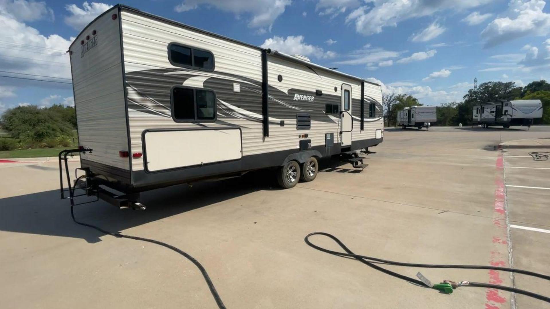 2017 TAN FOREST RIVER AVENGER 31DBS (5ZT2AVWB1HB) , Length: 35.75 ft | Dry Weight: 7,189 lbs. | Gross Weight: 9,589 lbs. | Slides: 1 transmission, located at 4319 N Main Street, Cleburne, TX, 76033, (817) 221-0660, 32.435829, -97.384178 - This is the 2017 Forest River Avenger 31DBS. It's your ticket to fun and excitement on the open road with your family. The length of this travel trailer is 35.75 feet and its dry weight is 7,189 lbs. When you walk inside, you'll find a plan that was made for comfort and ease. The bathroom in the bac - Photo#1