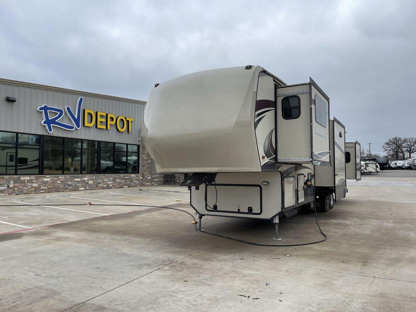 2017 BROWN FOREST RIVER SANIBEL 3901FL (5ZT3SN4B1HG) , Length: 41.83 ft. | Dry Weight: 13,979 lbs. | Slides: 5 transmission, located at 4319 N Main Street, Cleburne, TX, 76033, (817) 221-0660, 32.435829, -97.384178 - The 2017 Forest River Sanibel 3901FL Fifth Wheel delivers luxury and comfort on the road. This fifth wheel, measuring 41.83 feet long and weighing 13,979 pounds dry, provides roomy living accommodations with a plethora of quality conveniences. With five slides and dual entryways, this model offers p - Photo#0