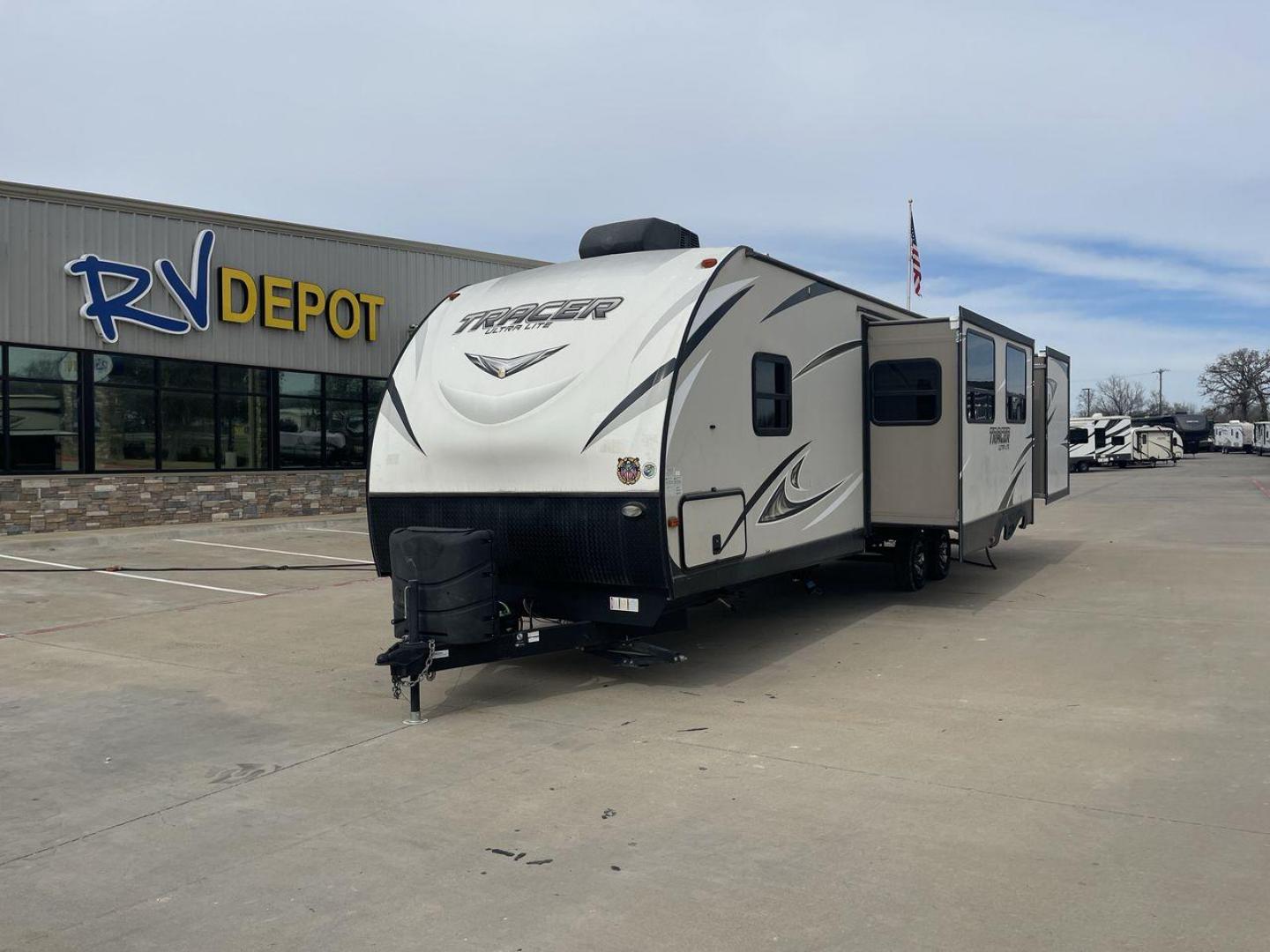 2017 TAN FOREST RIVER TRACER 3300BHD (5ZT2TRYB8HB) , Length: 37.58 ft. | Dry Weight: 7,520 lbs. | Slides: 2 transmission, located at 4319 N Main Street, Cleburne, TX, 76033, (817) 221-0660, 32.435829, -97.384178 - The 2017 Forest River Tracer 3300 is a dual-axle aluminum wheel set-up measuring 37.58 ft. It has a dry weight of 7,520 lbs. It comes equipped with two power-retractable slides and a 19-foot power-retractable awning. Inside, you will find a bunkhouse, a queen-sized bed, and three convertible sofa be - Photo#0