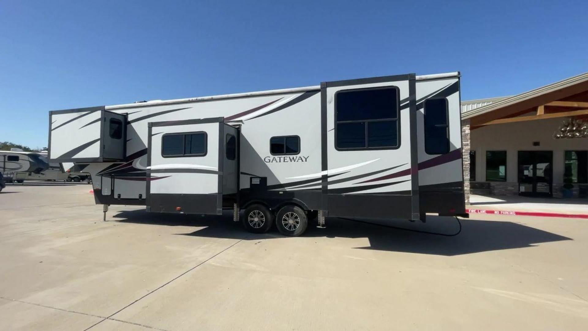 2017 TAN GATEWAY 3712RDMB - (5SFSG4228HE) , Length: 39.5 ft. | Dry Weight: 13,680 lbs. | Gross Weight: 15,500 lbs. | Slides: 4 transmission, located at 4319 N Main Street, Cleburne, TX, 76033, (817) 221-0660, 32.435829, -97.384178 - The 2017 Gateway 3712RDMB Fifth Wheel provides luxurious travel experiences. With a length of 39.5 feet and a dry weight of 13,680 pounds, this amazing RV provides large living accommodations and all of the conveniences you require for a comfortable travel. With a gross weight of 15,500 pounds and f - Photo#1