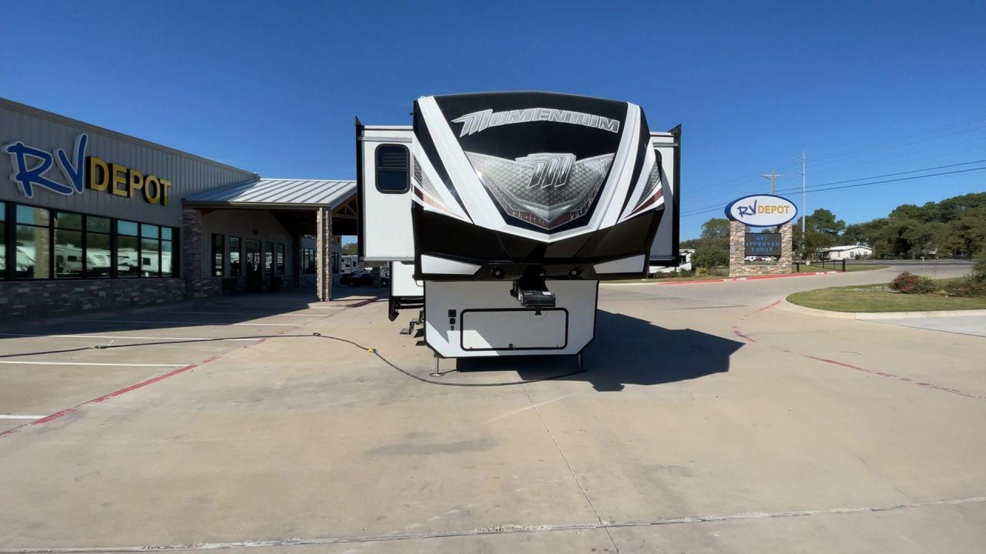 2017 GRAND DESIGN MOMENTUM 376TH (573FM4330H1) , Length: 41.25 ft. | Dry Weight: 15,900 lbs. | Gross Weight: 20,000 lbs. | Slides: 5 transmission, located at 4319 N Main Street, Cleburne, TX, 76033, (817) 221-0660, 32.435829, -97.384178 - The 2017 Grand Design Momentum 376TH is a spacious fifth wheel. It measures 41.25 feet in length and built for comfort and convenience. With a dry weight of 15,900 lbs and a gross weight capacity of 20,000 lbs, this RV is sturdy and ready for adventure. It features five slide-outs, providing ample l - Photo#4