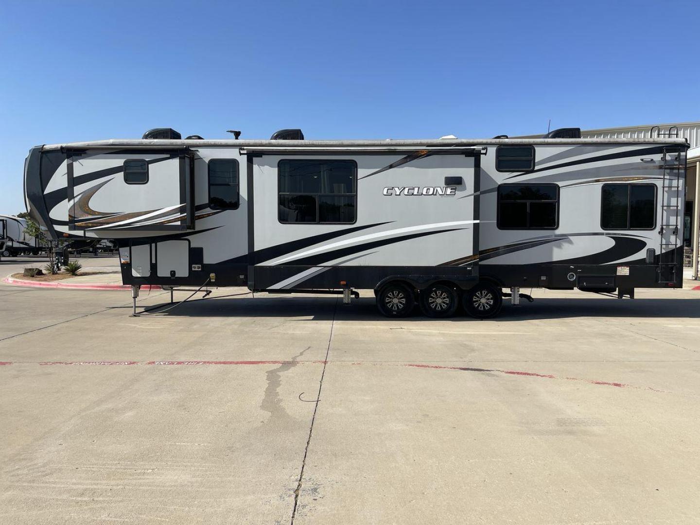 2017 HEARTLAND CYCLONE 4005 (5SFCG4434HE) , Length: 44.1 ft. | Dry Weight: 16,290 lbs.| Gross Weight: 20,000 lbs. | Slides: 3 transmission, located at 4319 N Main Street, Cleburne, TX, 76033, (817) 221-0660, 32.435829, -97.384178 - The 2017 Heartland Cyclone 4005 is a luxury fifth-wheel toy hauler that combines comfort and functionality for adventurers who want the flexibility to bring toys along for the ride. Known for its spacious garage, upscale living area, and ample sleeping options, this model is ideal for thrill-seekers - Photo#24