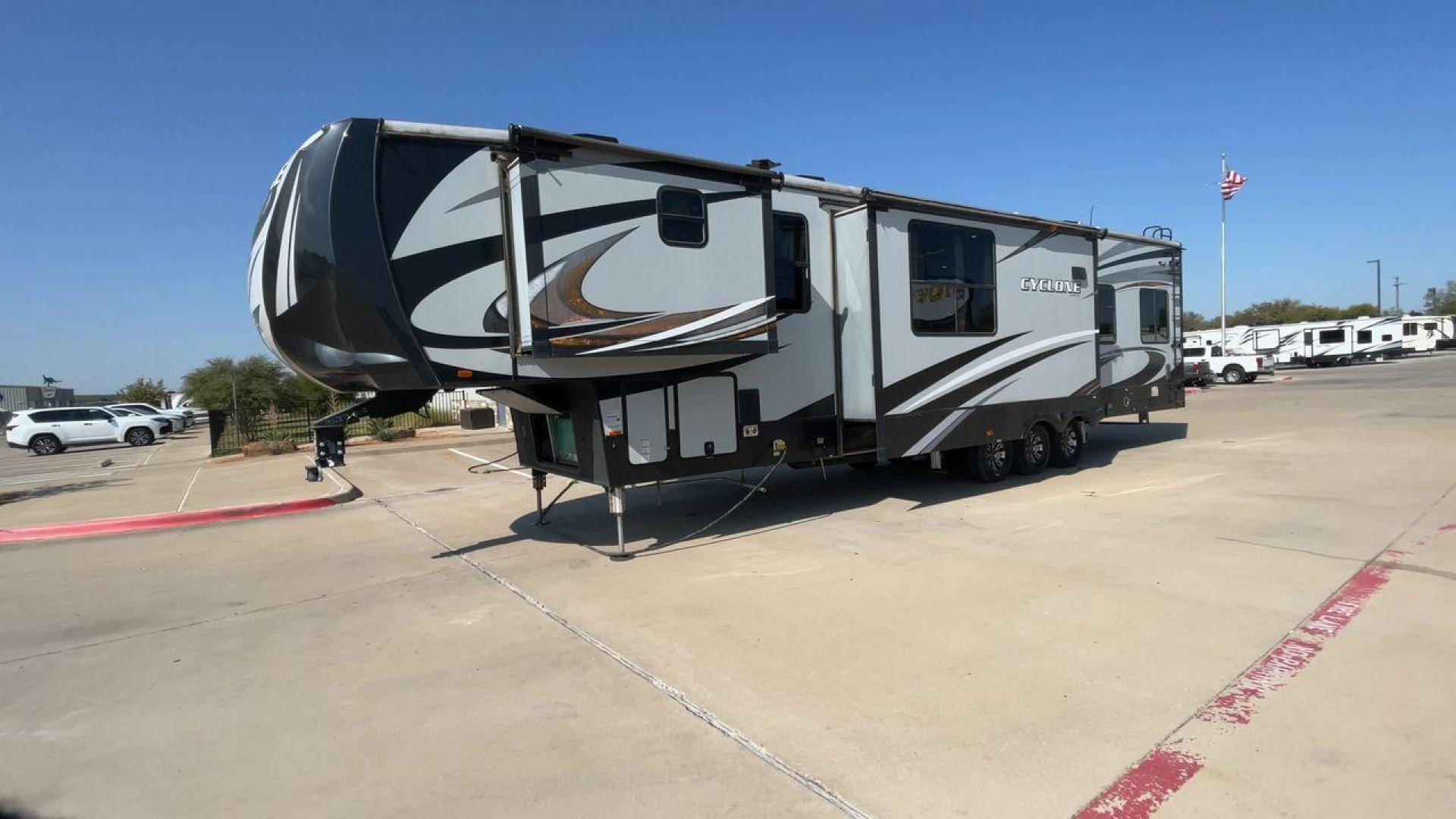 2017 HEARTLAND CYCLONE 4005 (5SFCG4434HE) , Length: 44.1 ft. | Dry Weight: 16,290 lbs.| Gross Weight: 20,000 lbs. | Slides: 3 transmission, located at 4319 N Main Street, Cleburne, TX, 76033, (817) 221-0660, 32.435829, -97.384178 - The 2017 Heartland Cyclone 4005 is a luxury fifth-wheel toy hauler that combines comfort and functionality for adventurers who want the flexibility to bring toys along for the ride. Known for its spacious garage, upscale living area, and ample sleeping options, this model is ideal for thrill-seekers - Photo#5