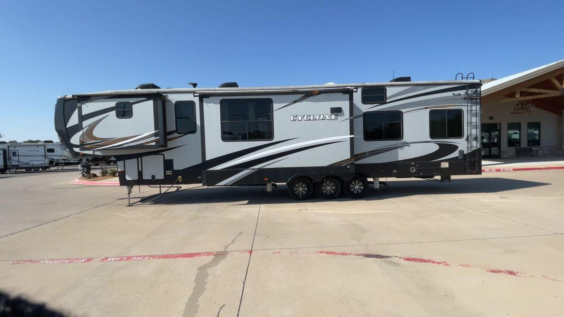 2017 HEARTLAND CYCLONE 4005 (5SFCG4434HE) , Length: 44.1 ft. | Dry Weight: 16,290 lbs.| Gross Weight: 20,000 lbs. | Slides: 3 transmission, located at 4319 N Main Street, Cleburne, TX, 76033, (817) 221-0660, 32.435829, -97.384178 - The 2017 Heartland Cyclone 4005 is a luxury fifth-wheel toy hauler that combines comfort and functionality for adventurers who want the flexibility to bring toys along for the ride. Known for its spacious garage, upscale living area, and ample sleeping options, this model is ideal for thrill-seekers - Photo#6