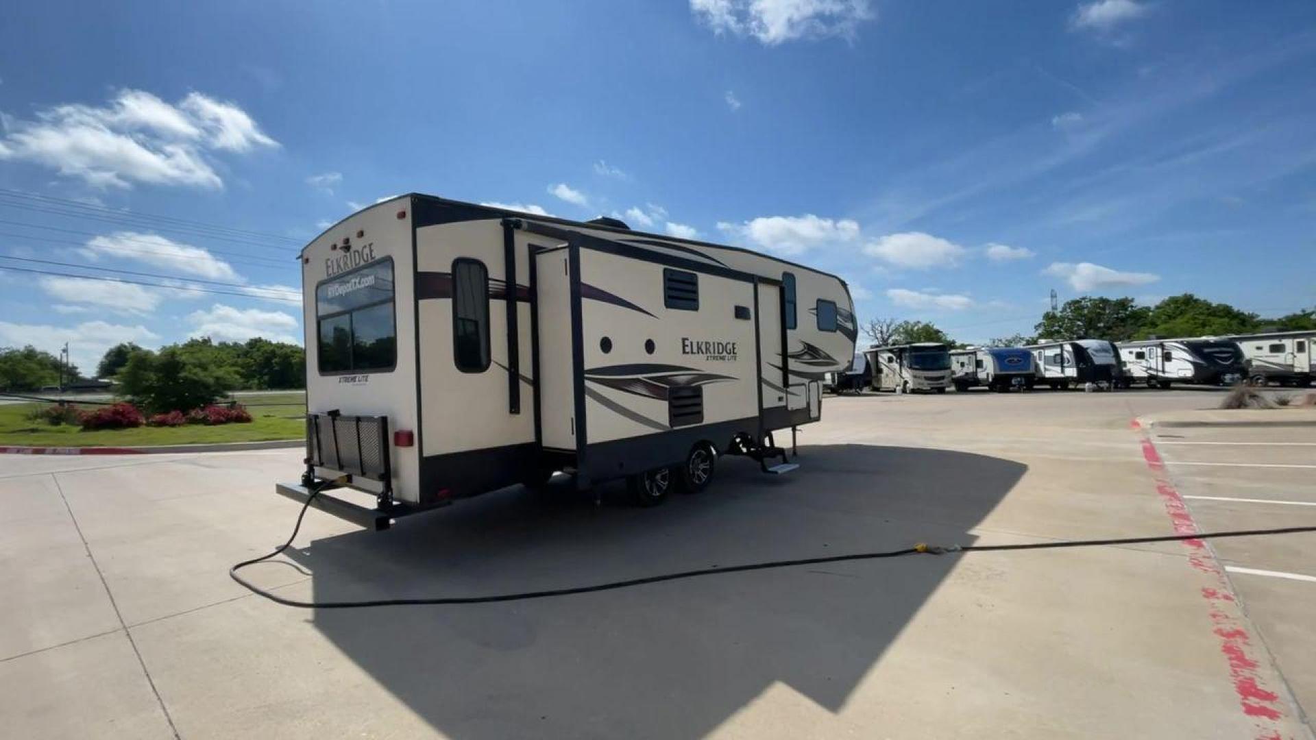 2017 HEARTLAND ELKRIDGE E293 (5SFRG3322HE) , Length: 32 ft. | GVWR: 11,600 lbs. | Slides: 2 transmission, located at 4319 N Main Street, Cleburne, TX, 76033, (817) 221-0660, 32.435829, -97.384178 - In this 2017 Heartland Recreation Elkridge E293, you may travel while enjoying all the comforts of home! This unit measures approximately 32 feet in length and is built with two large slides for greater interior space. The interior features a combined living and kitchen area, a full bathroom, and a - Photo#1