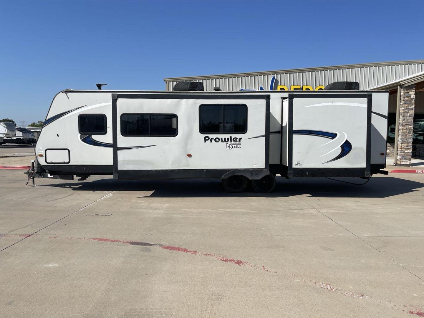 2017 HEARTLAND PROWLER 32LX (5SFPB3622JE) , Length: 36.4 ft. | Dry Weight: 7,880 lbs | Gross Weight: 9,000 lbs | Slides: 2 transmission, located at 4319 N Main Street, Cleburne, TX, 76033, (817) 221-0660, 32.435829, -97.384178 - The 2017 Heartland Prowler 32LX travel trailer has dimensions of 36.4 ft in length, 8 ft width, 11.2 ft height, and 6.8 ft interior height. It has a base weight of 7,880 lbs with a 9,000 lbs GVWR and a carrying capacity of 1,120 lbs. This unit highlights an outdoor kitchen, a rear bunkhouse, a p - Photo#24