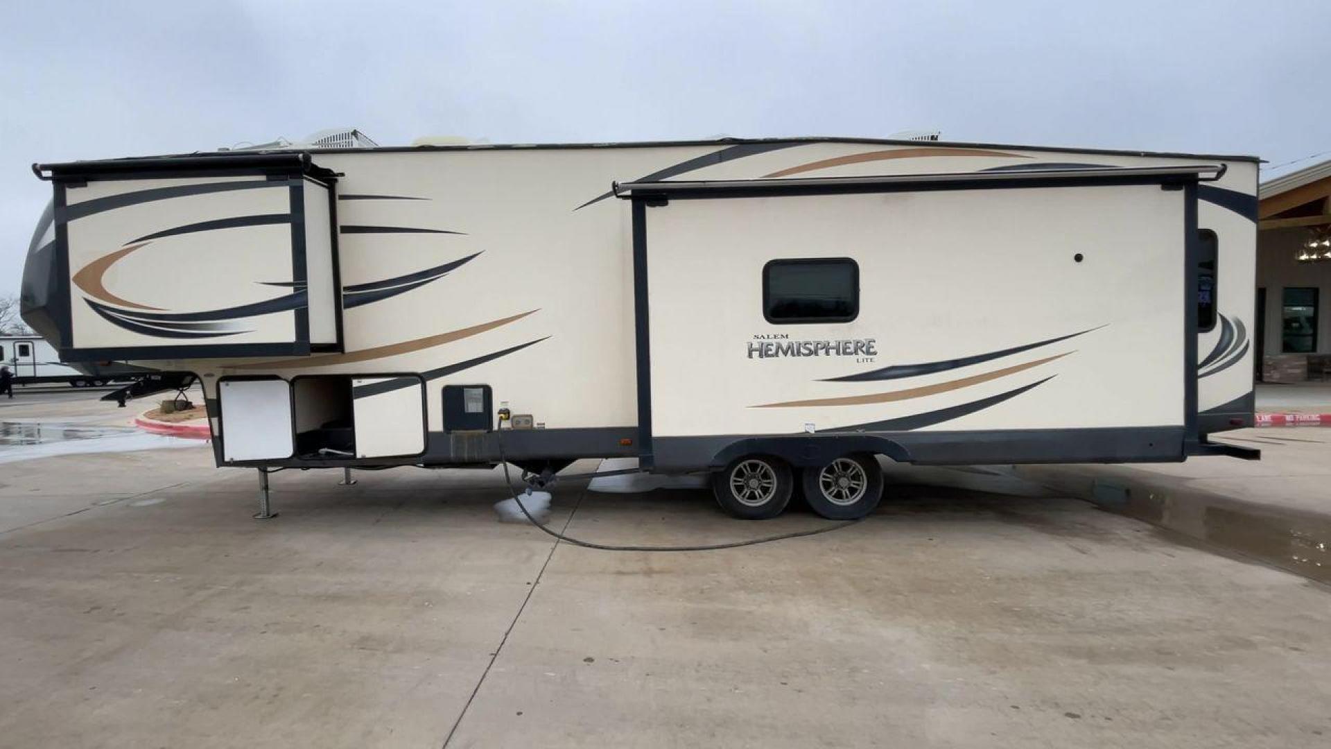 2017 TAN HEMISPHERE 337BAR (4X4FSBK25HV) , Length: 39.58 ft. | Dry Weight: 10,069 lbs. | Slides: 3 transmission, located at 4319 N Main Street, Cleburne, TX, 76033, (817) 221-0660, 32.435829, -97.384178 - This 2017 Forest River Salem Hemisphere Lite 337BAR fifth wheel measures 39.58 feet. It is a dual axle, aluminum wheel setup with electric drum brakes. Its dry weight is 10,069 lbs, its payload capacity is 2,321 lbs, and its hitch weight is 1,990 lbs. The fiberglass exterior is painted white with bl - Photo#6