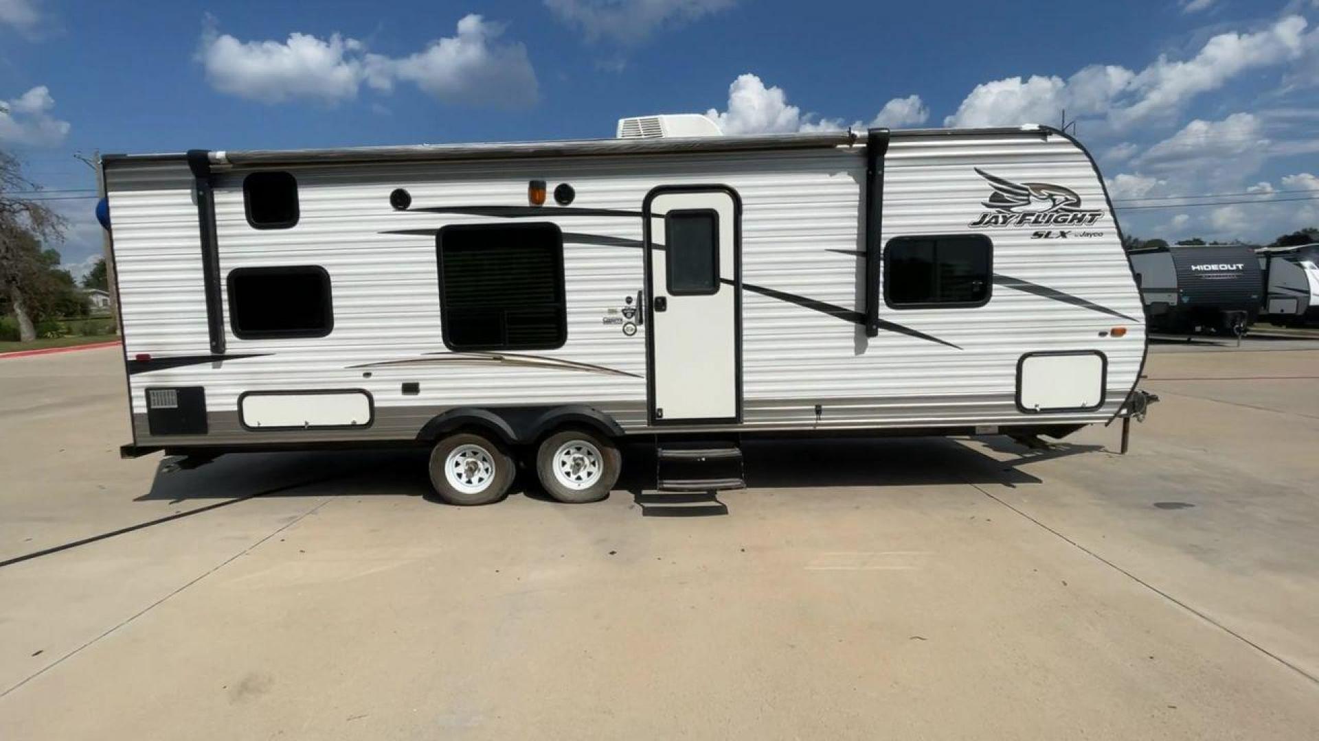 2017 JAYCO JAYFLIGHT 264BH (1UJBJ0BN3H1) , located at 4319 N Main Street, Cleburne, TX, 76033, (817) 221-0660, 32.435829, -97.384178 - The 2017 Jayco Jay Flight 264BH is a well-designed and practical travel trailer. It is ideal for families or groups looking to enjoy the great outdoors with all the comforts of home. This unit is lightweight and easy to tow, yet offers ample space for up to 8 people. The exterior is sleek with alumi - Photo#2