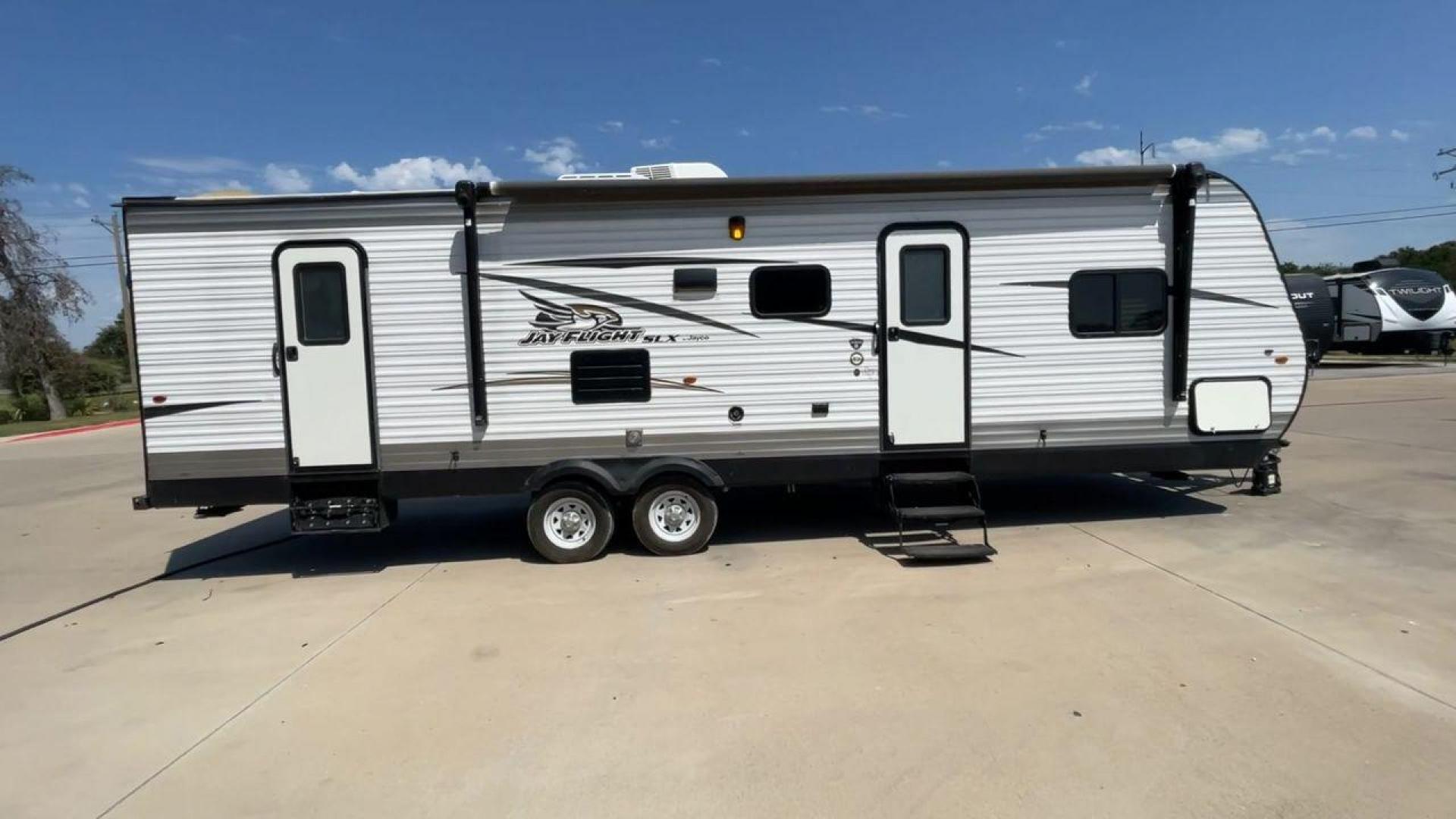 2017 WHITE JAYCO JAYFLIGHT 28BHBE (1UJBJ0BR8H1) , Length: 33.42 ft. | Dry Weight: 6,510 lbs. | Gross Weight: 9,250 lbs. | Slides: 1 transmission, located at 4319 N Main Street, Cleburne, TX, 76033, (817) 221-0660, 32.435829, -97.384178 - The 2017 Jayco Jay Flight 28BHBE is a dual-axle steel wheel set-up measuring 33.42 ft. in length. It has a dry weight of 6,510 lbs. and a GVWR of 9,250 lbs. It is made of wood and aluminum. It has 1 slide and it can sleep up to 10 people. Starting at the back of the trailer, we have a bunkhouse o - Photo#2