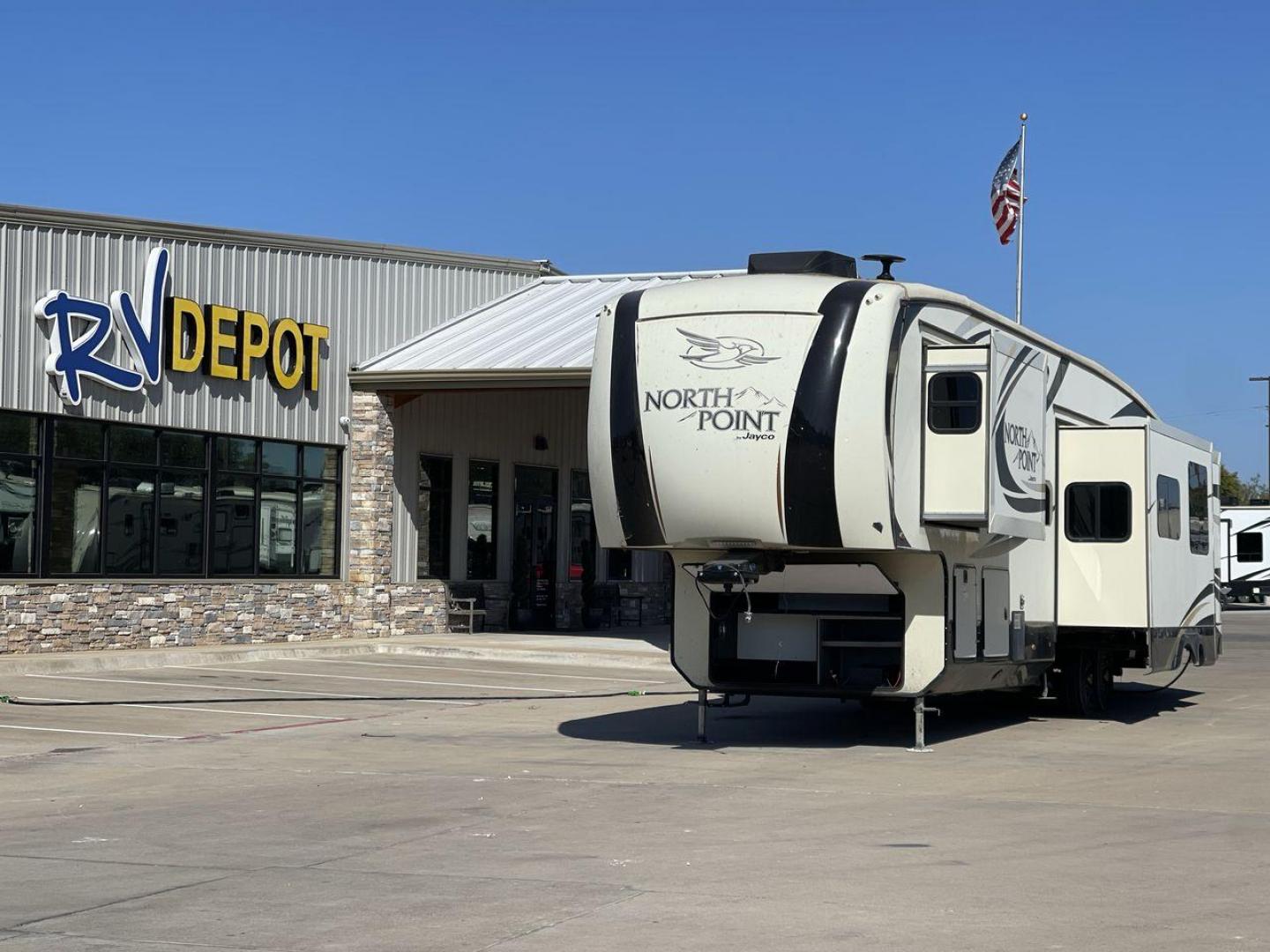 2017 TAN JAYCO NORTH POINT 375BHFS (1UJCJ0BV2H1) , Length: 43.25 ft.| Dry Weight: 13,740 lbs. | Gross Weight: 16,500 lbs. | Slides: 5 transmission, located at 4319 N Main Street, Cleburne, TX, 76033, (817) 221-0660, 32.435829, -97.384178 - Five slides, one-and-a-half baths, a bunkhouse, and an outdoor kitchen are just some of the highlights of this North Point fifth wheel model 375BHFS by Jayco. This fifth wheel measures 43.25 ft in length, 8 ft in width, 13.33 ft in height, and 6.83 ft in interior height. It has a dry weight of 1 - Photo#0