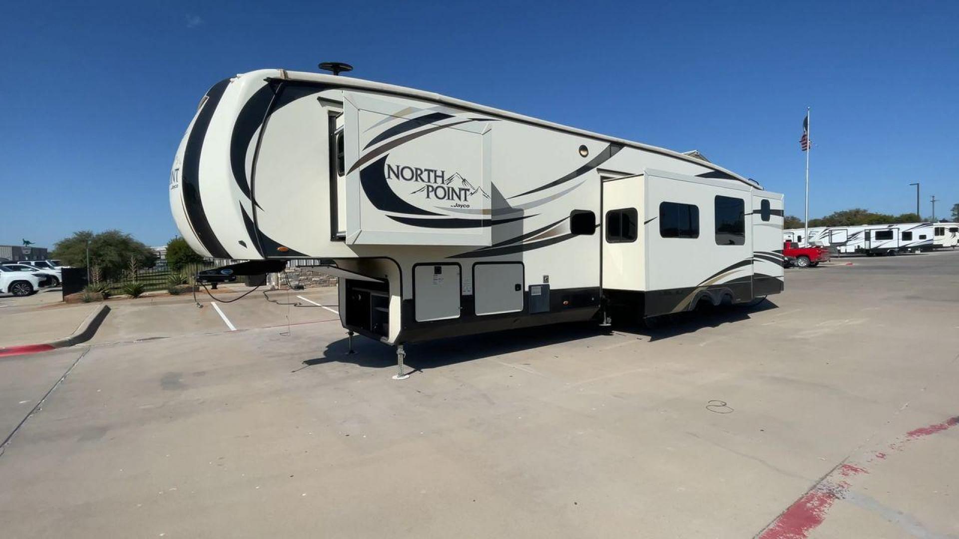 2017 TAN JAYCO NORTH POINT 375BHFS (1UJCJ0BV2H1) , Length: 43.25 ft.| Dry Weight: 13,740 lbs. | Gross Weight: 16,500 lbs. | Slides: 5 transmission, located at 4319 N Main Street, Cleburne, TX, 76033, (817) 221-0660, 32.435829, -97.384178 - Five slides, one-and-a-half baths, a bunkhouse, and an outdoor kitchen are just some of the highlights of this North Point fifth wheel model 375BHFS by Jayco. This fifth wheel measures 43.25 ft in length, 8 ft in width, 13.33 ft in height, and 6.83 ft in interior height. It has a dry weight of 1 - Photo#5