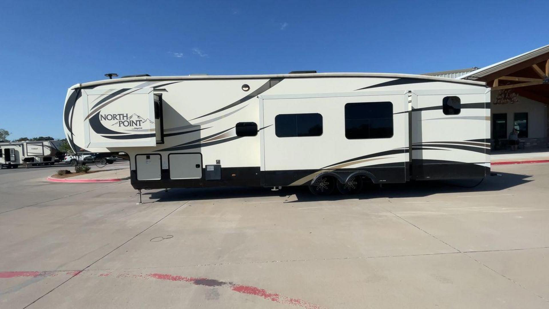 2017 TAN JAYCO NORTH POINT 375BHFS (1UJCJ0BV2H1) , Length: 43.25 ft.| Dry Weight: 13,740 lbs. | Gross Weight: 16,500 lbs. | Slides: 5 transmission, located at 4319 N Main Street, Cleburne, TX, 76033, (817) 221-0660, 32.435829, -97.384178 - Five slides, one-and-a-half baths, a bunkhouse, and an outdoor kitchen are just some of the highlights of this North Point fifth wheel model 375BHFS by Jayco. This fifth wheel measures 43.25 ft in length, 8 ft in width, 13.33 ft in height, and 6.83 ft in interior height. It has a dry weight of 1 - Photo#6