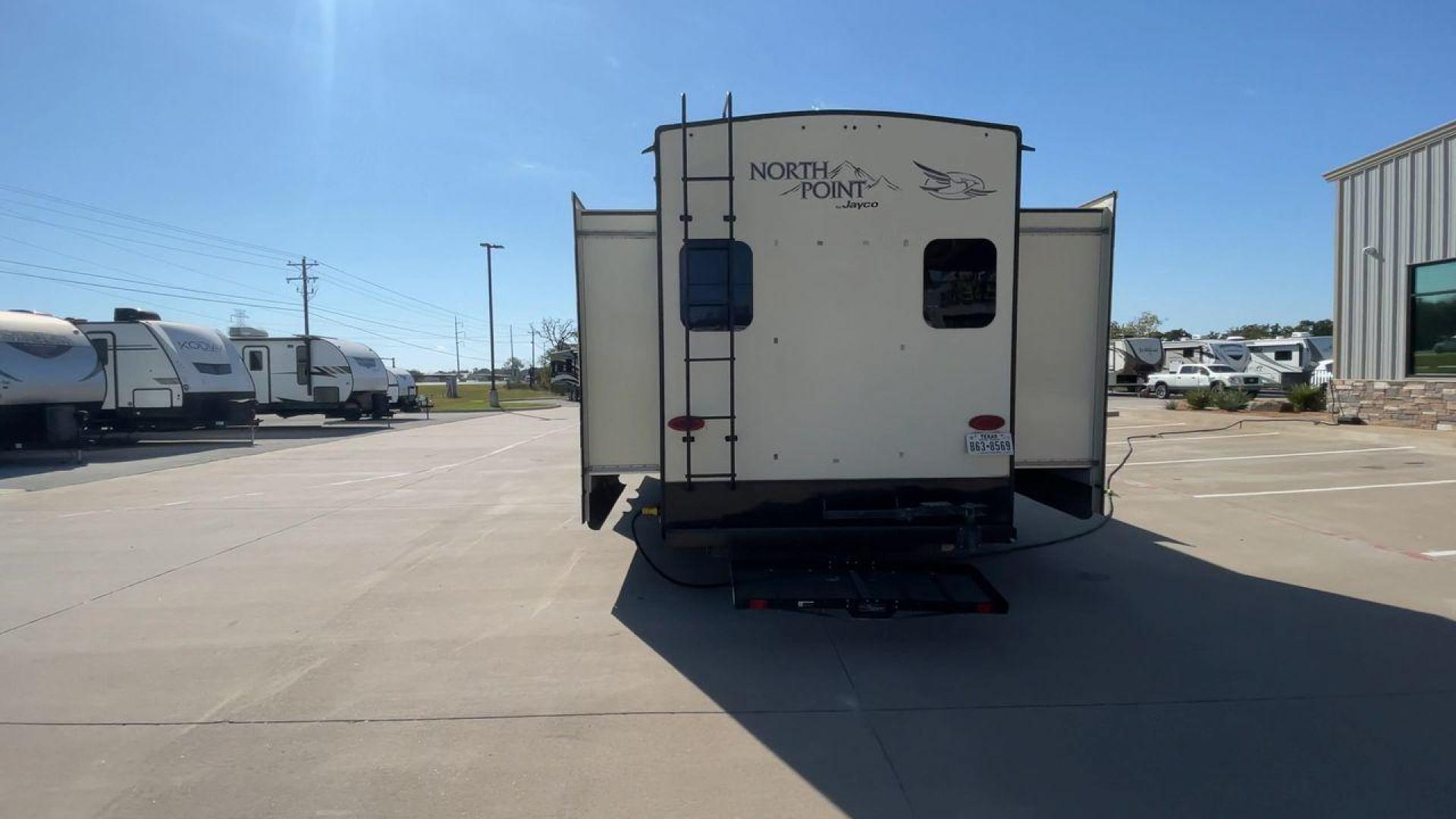 2017 TAN JAYCO NORTH POINT 375BHFS (1UJCJ0BV2H1) , Length: 43.25 ft.| Dry Weight: 13,740 lbs. | Gross Weight: 16,500 lbs. | Slides: 5 transmission, located at 4319 N Main Street, Cleburne, TX, 76033, (817) 221-0660, 32.435829, -97.384178 - Five slides, one-and-a-half baths, a bunkhouse, and an outdoor kitchen are just some of the highlights of this North Point fifth wheel model 375BHFS by Jayco. This fifth wheel measures 43.25 ft in length, 8 ft in width, 13.33 ft in height, and 6.83 ft in interior height. It has a dry weight of 1 - Photo#8