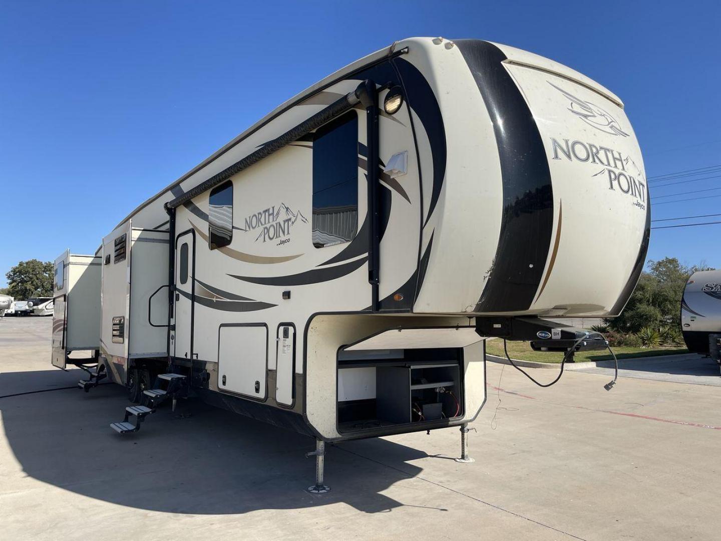 2017 TAN JAYCO NORTH POINT 375BHFS (1UJCJ0BV2H1) , Length: 43.25 ft.| Dry Weight: 13,740 lbs. | Gross Weight: 16,500 lbs. | Slides: 5 transmission, located at 4319 N Main Street, Cleburne, TX, 76033, (817) 221-0660, 32.435829, -97.384178 - Five slides, one-and-a-half baths, a bunkhouse, and an outdoor kitchen are just some of the highlights of this North Point fifth wheel model 375BHFS by Jayco. This fifth wheel measures 43.25 ft in length, 8 ft in width, 13.33 ft in height, and 6.83 ft in interior height. It has a dry weight of 1 - Photo#22