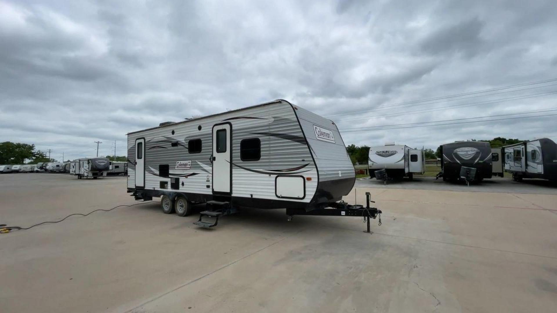 2017 WHITE KEYSTONE COLEMAN 263BH (4YDT26322HH) , Length: 30.58 ft. | Dry Weight: 5,820 lbs. | Slides: 1 transmission, located at 4319 N Main Street, Cleburne, TX, 76033, (817) 221-0660, 32.435829, -97.384178 - The 2017 Keystone Coleman 263BH is a compact yet spacious travel trailer designed to bring comfort and convenience to your road adventures. This RV stretches 30.58 feet in length and boasts a manageable dry weight of 5,820 pounds, making it an excellent choice for families looking to explore the gre - Photo#3