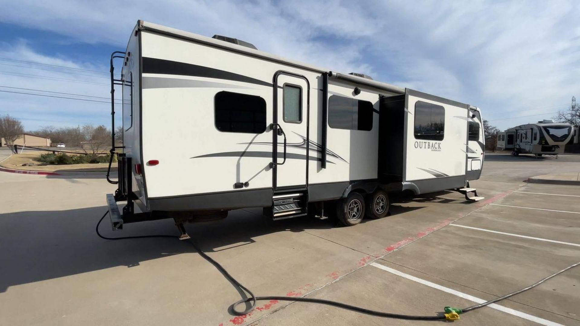 2017 KEYSTONE OUTBACK 332FK (4YDT33229HB) , Length: 37.83 ft. | Dry Weight: 8,475 lbs. | Gross Weight: 10,500 lbs. | Slides: 3 transmission, located at 4319 N Main Street, Cleburne, TX, 76033, (817) 221-0660, 32.435829, -97.384178 - Photo#1