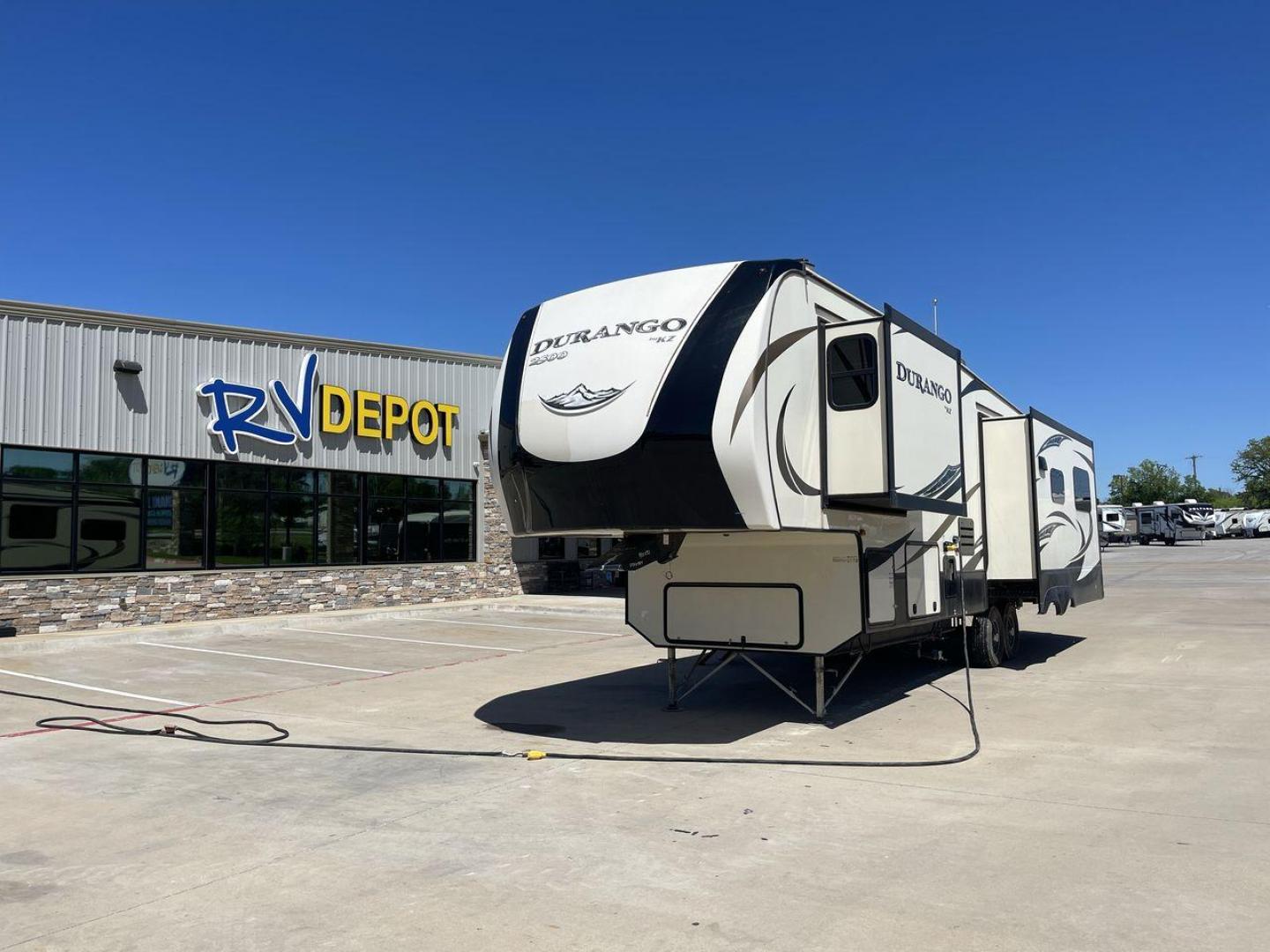 2017 TAN KZ DURANGO 336RET (4EZFD3324H6) , Length: 35.33 ft. | Dry Weight: 10,070 lbs. | Gross Weight: 12,500 lbs. | Slides: 3 transmission, located at 4319 N Main Street, Cleburne, TX, 76033, (817) 221-0660, 32.435829, -97.384178 - The 2017 K-Z Durango 336RET is a fantastic residential fifth wheel with numerous luxurious features you will enjoy in an RV! This Durango measures 35.33 ft. in length and 12.83 ft. in height. It has a dry weight of 10,070 lbs. and a GVWR of 12,500 lbs. You will be able to pull this fifth wheel with - Photo#0