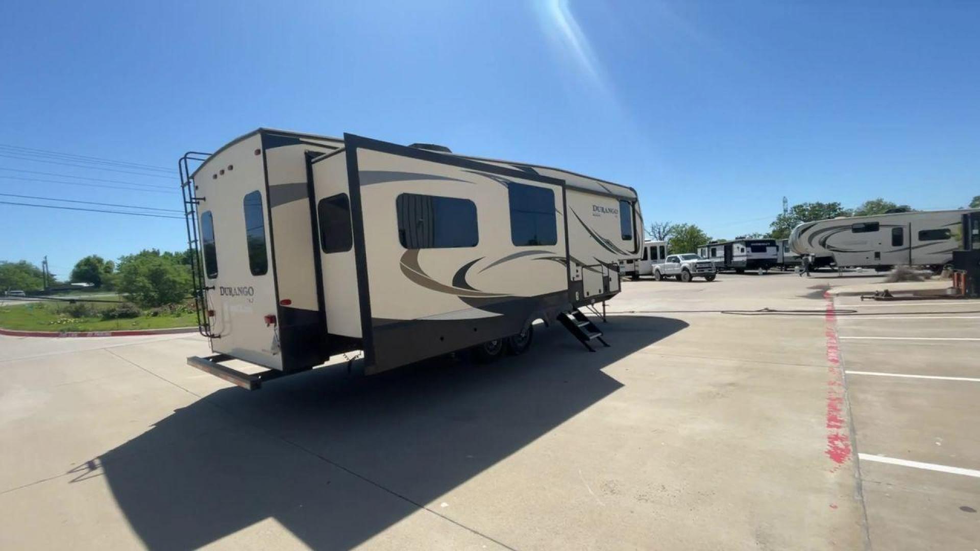 2017 TAN KZ DURANGO 336RET (4EZFD3324H6) , Length: 35.33 ft. | Dry Weight: 10,070 lbs. | Gross Weight: 12,500 lbs. | Slides: 3 transmission, located at 4319 N Main Street, Cleburne, TX, 76033, (817) 221-0660, 32.435829, -97.384178 - The 2017 K-Z Durango 336RET is a fantastic residential fifth wheel with numerous luxurious features you will enjoy in an RV! This Durango measures 35.33 ft. in length and 12.83 ft. in height. It has a dry weight of 10,070 lbs. and a GVWR of 12,500 lbs. You will be able to pull this fifth wheel with - Photo#1