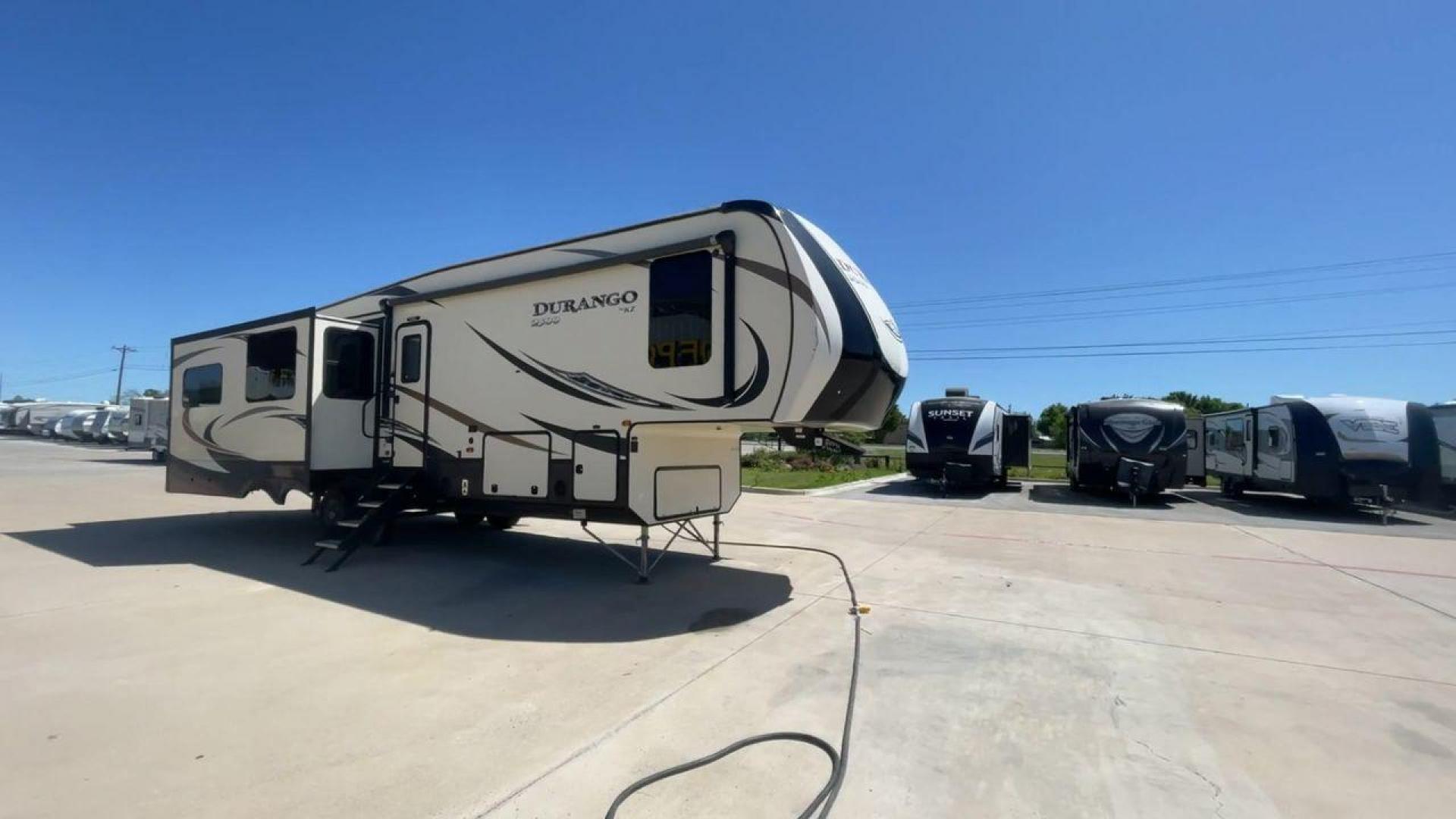 2017 TAN KZ DURANGO 336RET (4EZFD3324H6) , Length: 35.33 ft. | Dry Weight: 10,070 lbs. | Gross Weight: 12,500 lbs. | Slides: 3 transmission, located at 4319 N Main Street, Cleburne, TX, 76033, (817) 221-0660, 32.435829, -97.384178 - The 2017 K-Z Durango 336RET is a fantastic residential fifth wheel with numerous luxurious features you will enjoy in an RV! This Durango measures 35.33 ft. in length and 12.83 ft. in height. It has a dry weight of 10,070 lbs. and a GVWR of 12,500 lbs. You will be able to pull this fifth wheel with - Photo#3