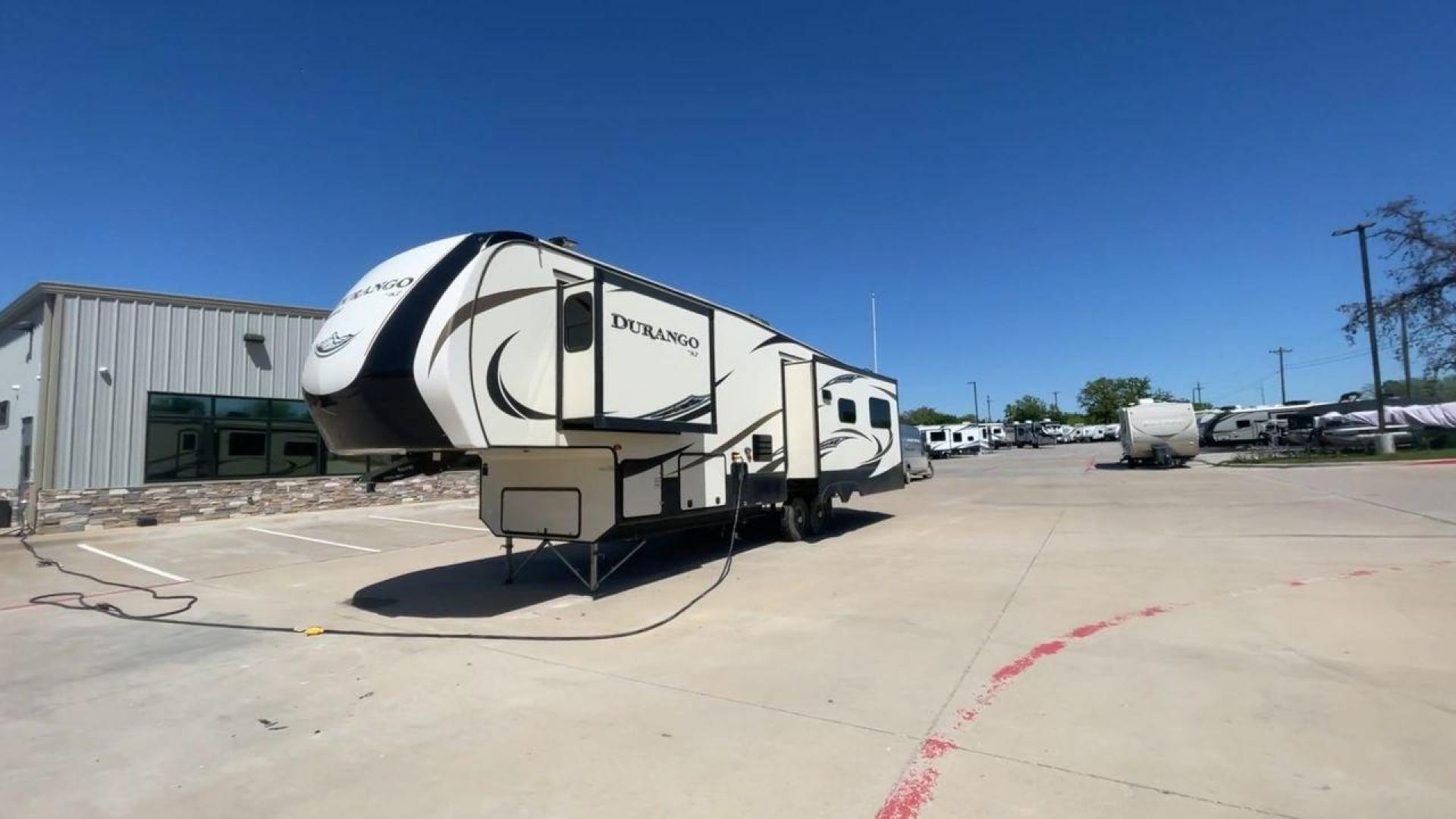 2017 TAN KZ DURANGO 336RET (4EZFD3324H6) , Length: 35.33 ft. | Dry Weight: 10,070 lbs. | Gross Weight: 12,500 lbs. | Slides: 3 transmission, located at 4319 N Main Street, Cleburne, TX, 76033, (817) 221-0660, 32.435829, -97.384178 - The 2017 K-Z Durango 336RET is a fantastic residential fifth wheel with numerous luxurious features you will enjoy in an RV! This Durango measures 35.33 ft. in length and 12.83 ft. in height. It has a dry weight of 10,070 lbs. and a GVWR of 12,500 lbs. You will be able to pull this fifth wheel with - Photo#5