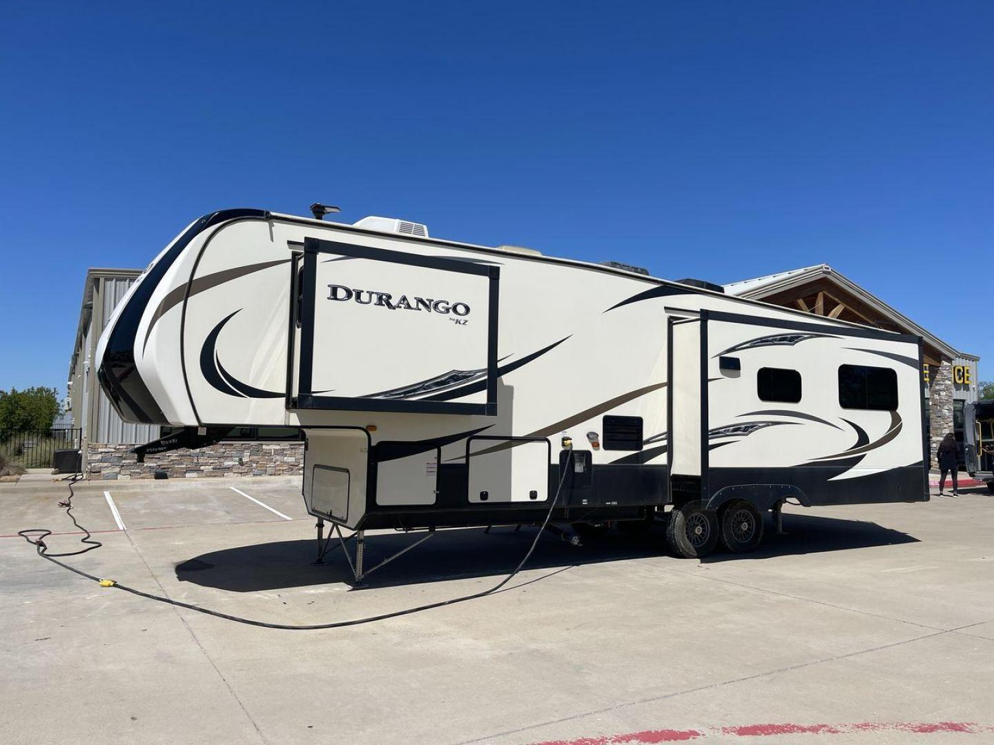 2017 TAN KZ DURANGO 336RET (4EZFD3324H6) , Length: 35.33 ft. | Dry Weight: 10,070 lbs. | Gross Weight: 12,500 lbs. | Slides: 3 transmission, located at 4319 N Main Street, Cleburne, TX, 76033, (817) 221-0660, 32.435829, -97.384178 - The 2017 K-Z Durango 336RET is a fantastic residential fifth wheel with numerous luxurious features you will enjoy in an RV! This Durango measures 35.33 ft. in length and 12.83 ft. in height. It has a dry weight of 10,070 lbs. and a GVWR of 12,500 lbs. You will be able to pull this fifth wheel with - Photo#24