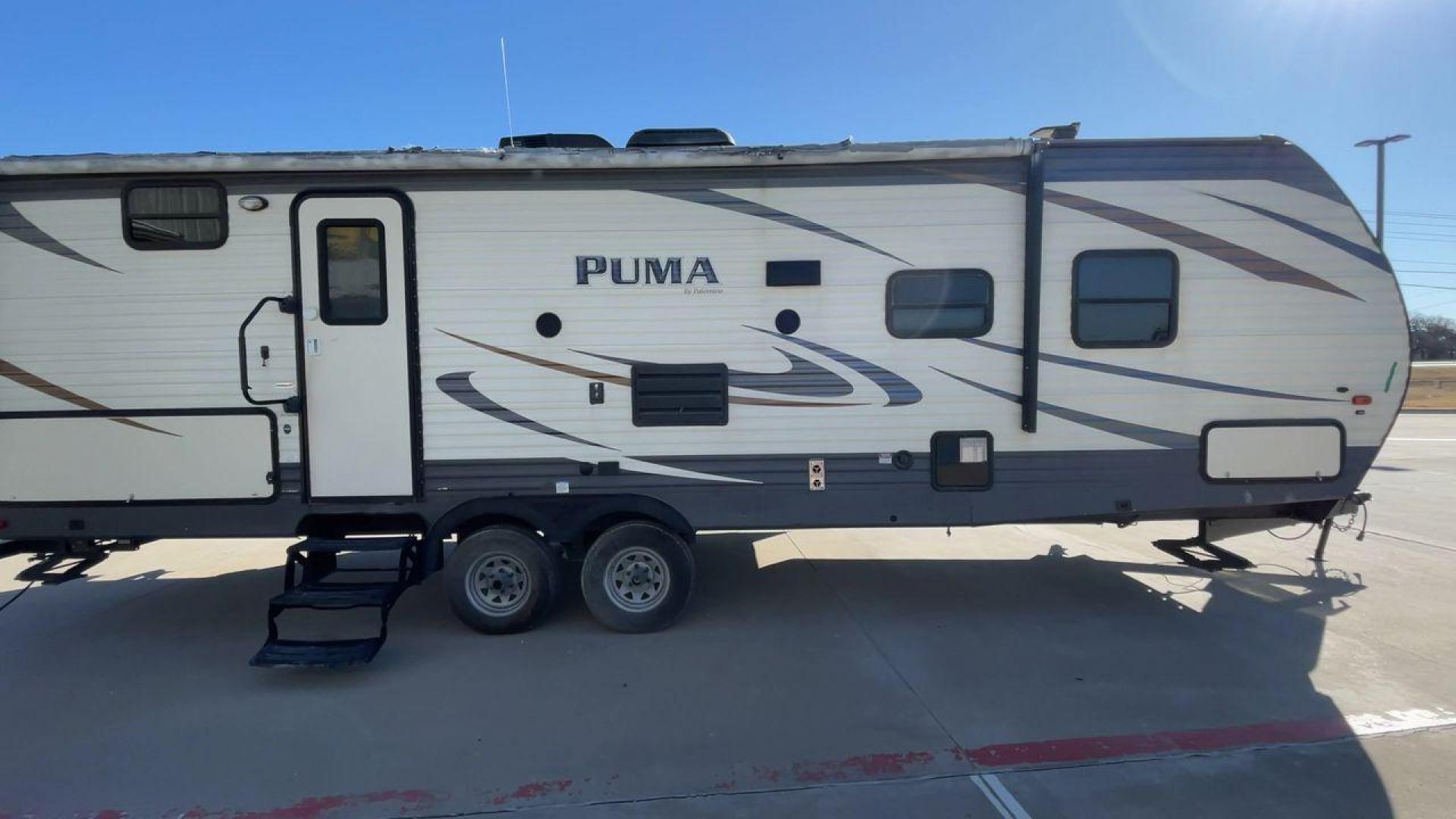 2017 PUMA XLITE28FQDB (4X4TPUD22HP) , Length: 33 ft | Dry Weight: 6,370 lbs | Gross Weight: 8,000 lbs | Slides: 1 transmission, located at 4319 N Main Street, Cleburne, TX, 76033, (817) 221-0660, 32.435829, -97.384178 - The 2017 Puma 28FQDB travel trailer is ideal for family excursions. With a length of 33 feet and a dry weight of 6,370 pounds, this RV is both large and lightweight, making it simple to tow and navigate on the road. With an outdoor kitchen and a large 20-foot motorized awning, you can enjoy outdoor - Photo#2