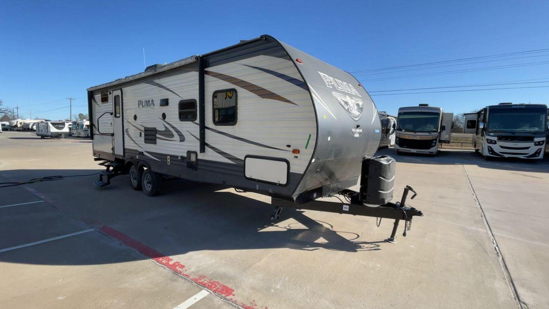 2017 PUMA XLITE28FQDB (4X4TPUD22HP) , Length: 33 ft | Dry Weight: 6,370 lbs | Gross Weight: 8,000 lbs | Slides: 1 transmission, located at 4319 N Main Street, Cleburne, TX, 76033, (817) 221-0660, 32.435829, -97.384178 - The 2017 Puma 28FQDB travel trailer is ideal for family excursions. With a length of 33 feet and a dry weight of 6,370 pounds, this RV is both large and lightweight, making it simple to tow and navigate on the road. With an outdoor kitchen and a large 20-foot motorized awning, you can enjoy outdoor - Photo#3