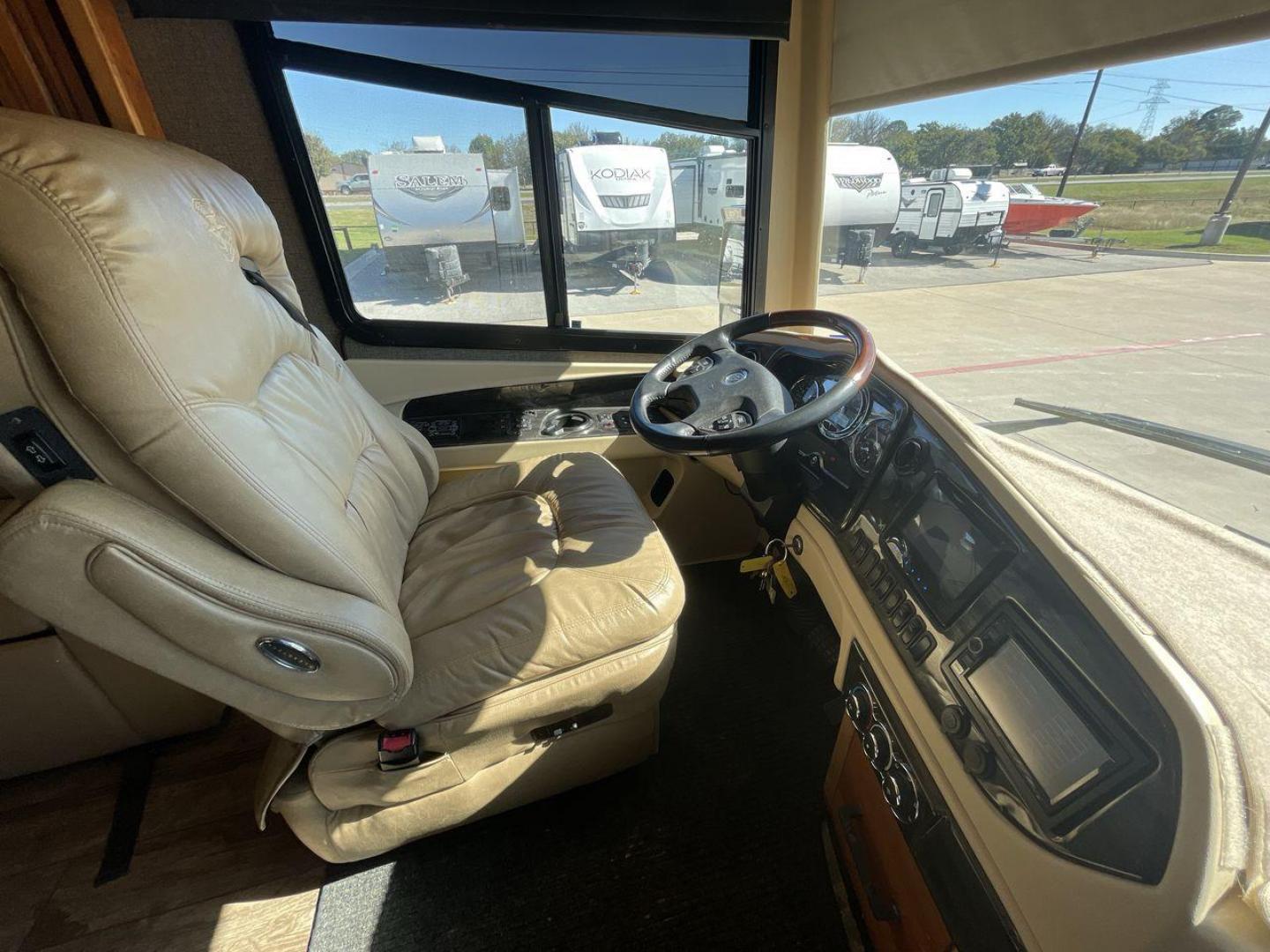 2017 TIFFIN ALLEGRO BUS 45OPP (5VBBAK7A6HA) , Length: 45 ft | Gross Weight: 51,000 lbs | Slides: 4 transmission, located at 4319 N Main Street, Cleburne, TX, 76033, (817) 221-0660, 32.435829, -97.384178 - The 2017 TIFFIN ALLEGRO BUS 45OPP features a luxurious exterior with a striking maroon, white, and beige paint scheme. The large, sleek side panels are accentuated by elegant, sweeping graphics, giving it an upscale, eye-catching look. The motorhome is built on a spacious chassis, with a prominent f - Photo#27