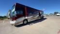 2017 TIFFIN ALLEGRO BUS 45OPP (5VBBAK7A6HA) , Length: 45 ft | Gross Weight: 51,000 lbs | Slides: 4 transmission, located at 4319 N Main Street, Cleburne, TX, 76033, (817) 221-0660, 32.435829, -97.384178 - The 2017 TIFFIN ALLEGRO BUS 45OPP features a luxurious exterior with a striking maroon, white, and beige paint scheme. The large, sleek side panels are accentuated by elegant, sweeping graphics, giving it an upscale, eye-catching look. The motorhome is built on a spacious chassis, with a prominent f - Photo#5