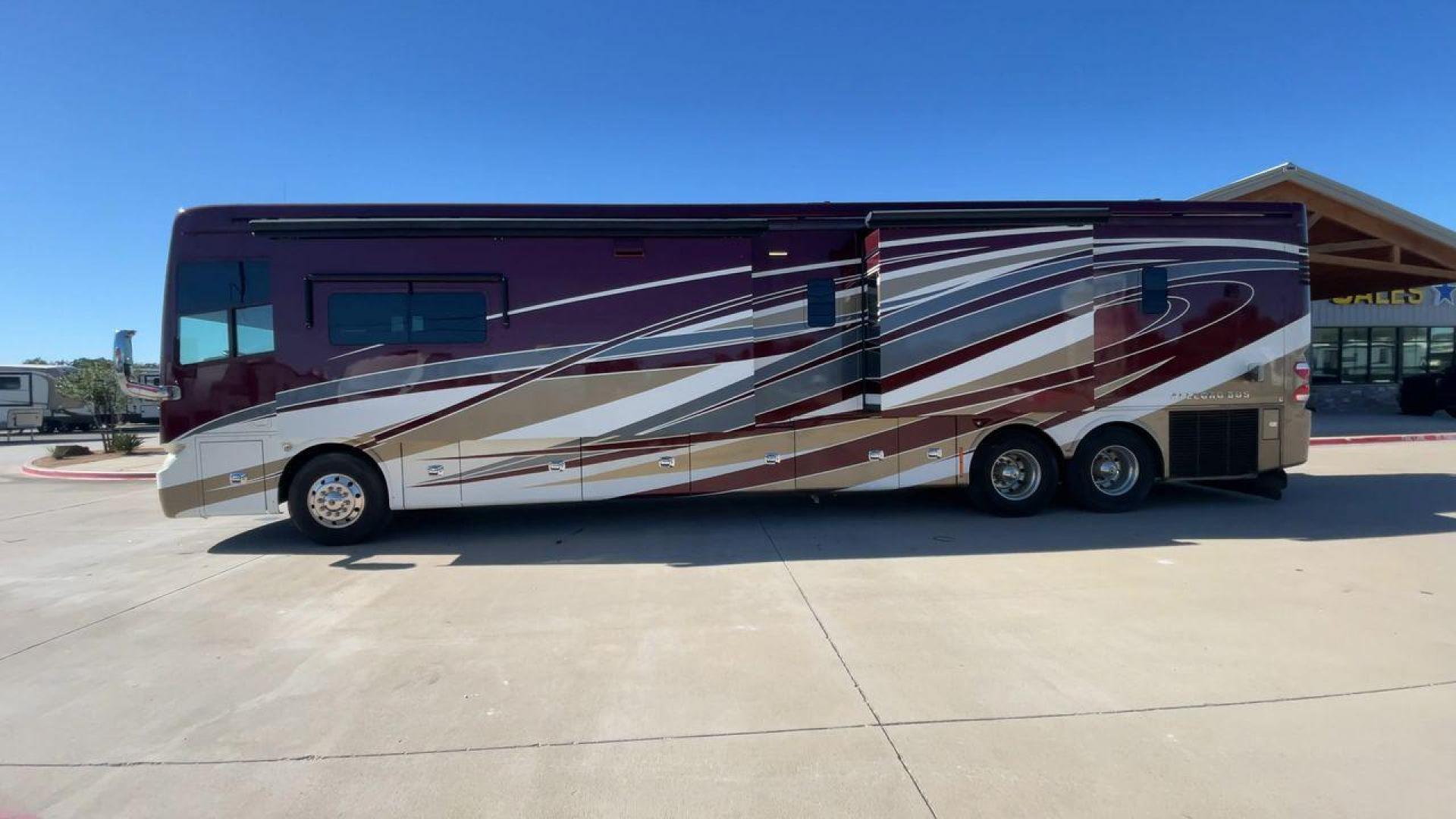 2017 TIFFIN ALLEGRO BUS 45OPP (5VBBAK7A6HA) , Length: 45 ft | Gross Weight: 51,000 lbs | Slides: 4 transmission, located at 4319 N Main Street, Cleburne, TX, 76033, (817) 221-0660, 32.435829, -97.384178 - The 2017 TIFFIN ALLEGRO BUS 45OPP features a luxurious exterior with a striking maroon, white, and beige paint scheme. The large, sleek side panels are accentuated by elegant, sweeping graphics, giving it an upscale, eye-catching look. The motorhome is built on a spacious chassis, with a prominent f - Photo#6