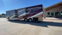 2017 TIFFIN ALLEGRO BUS 45OPP (5VBBAK7A6HA) , Length: 45 ft | Gross Weight: 51,000 lbs | Slides: 4 transmission, located at 4319 N Main Street, Cleburne, TX, 76033, (817) 221-0660, 32.435829, -97.384178 - The 2017 TIFFIN ALLEGRO BUS 45OPP features a luxurious exterior with a striking maroon, white, and beige paint scheme. The large, sleek side panels are accentuated by elegant, sweeping graphics, giving it an upscale, eye-catching look. The motorhome is built on a spacious chassis, with a prominent f - Photo#7